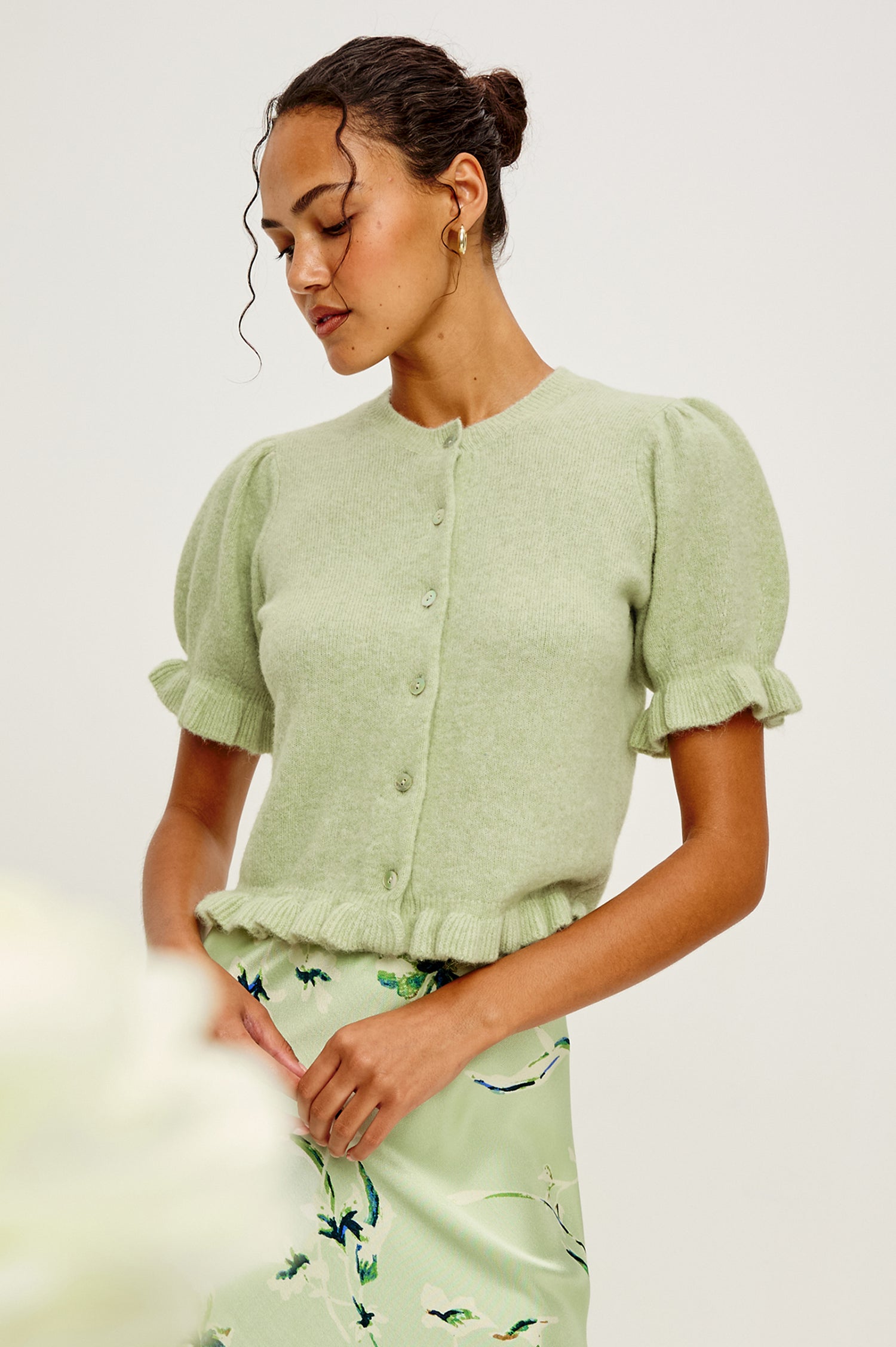 Lora Wool Cardigan With Crewneck, Short Puff Sleeves and Hem With Ruffle Trim, and Front Buttons in Julep Colorway - Upper Body Front View Featured on Model