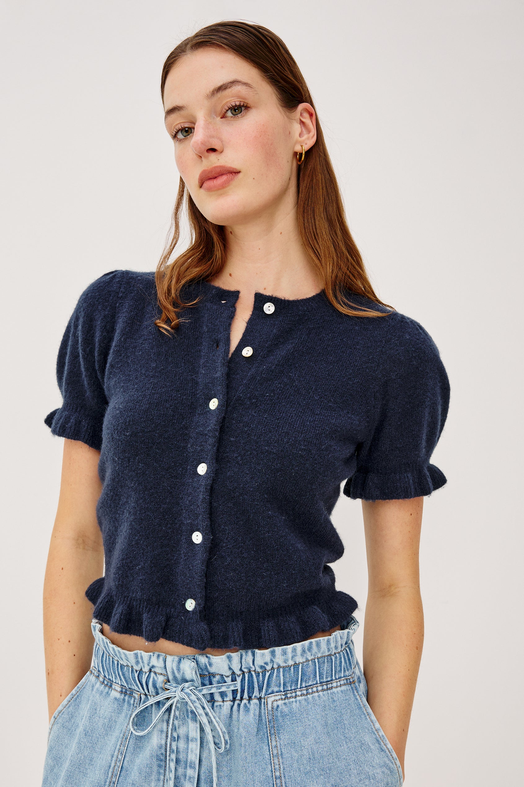 Lora Top in Wool Blend With Front Buttons, Short Puff Sleeves, Ruffle Trim, and Classic Fit in Navy Colorway - Upper Body Front View Featured on Model