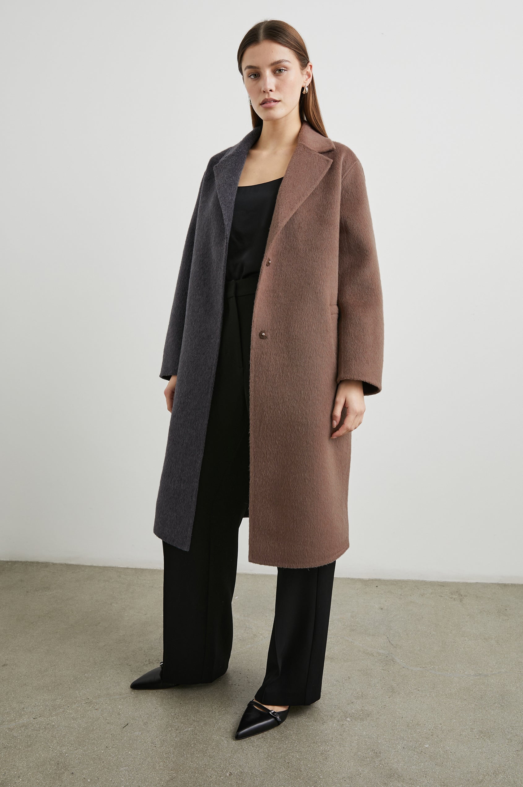 Lore Knee-Length Coat with Two Button Closure, Notched Lapels and Two Front Pockets in Charcoal Mink Mix Colorway, Left Half of Jacket is Mink and the Right Half is Charcoal  - Front Full Body View Featured on Model