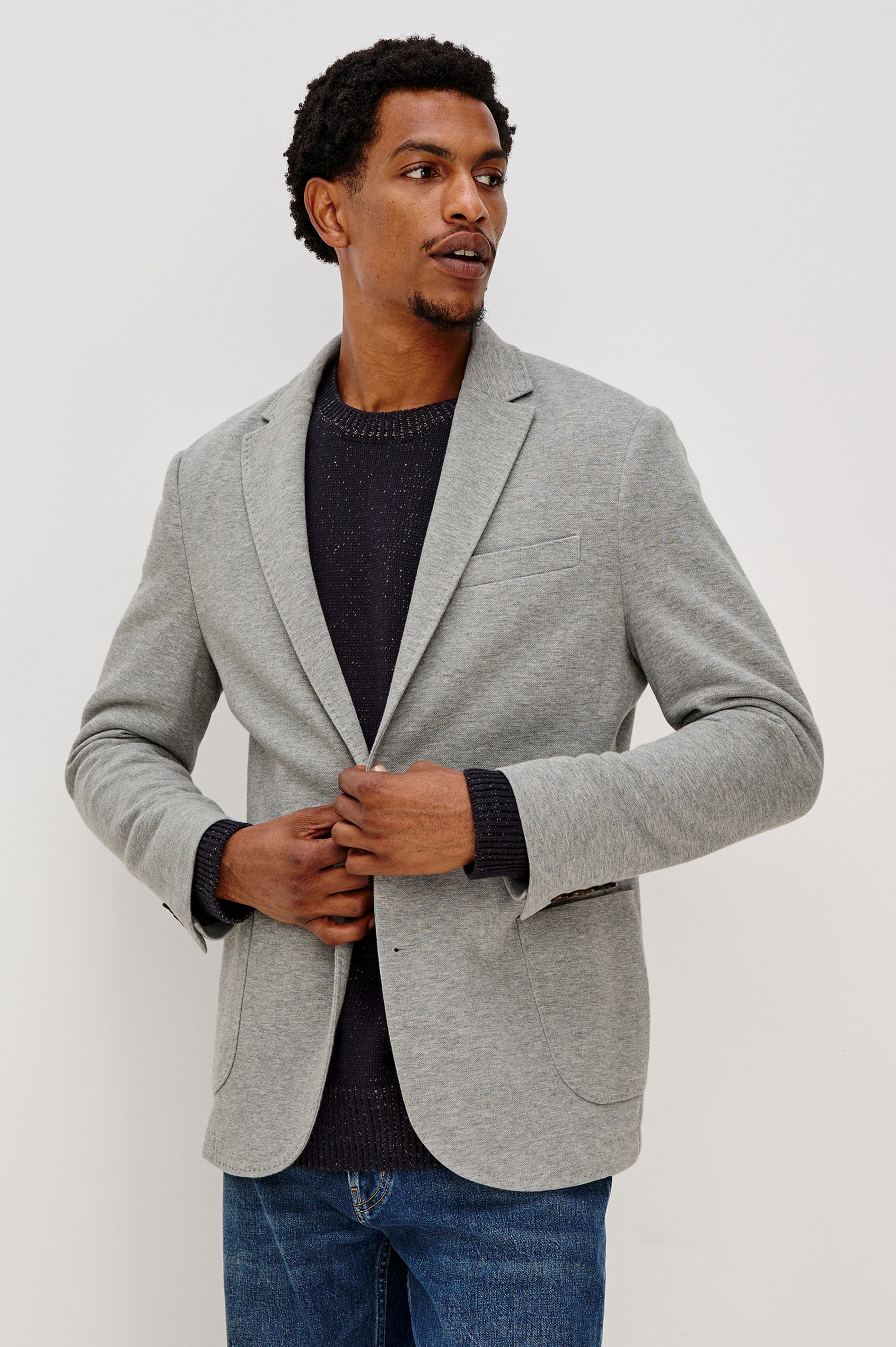 Lorenz Single Breasted Blazer with two patch pockets and one chest pocket in Heather Grey Colorway. Front View Shown on Model.