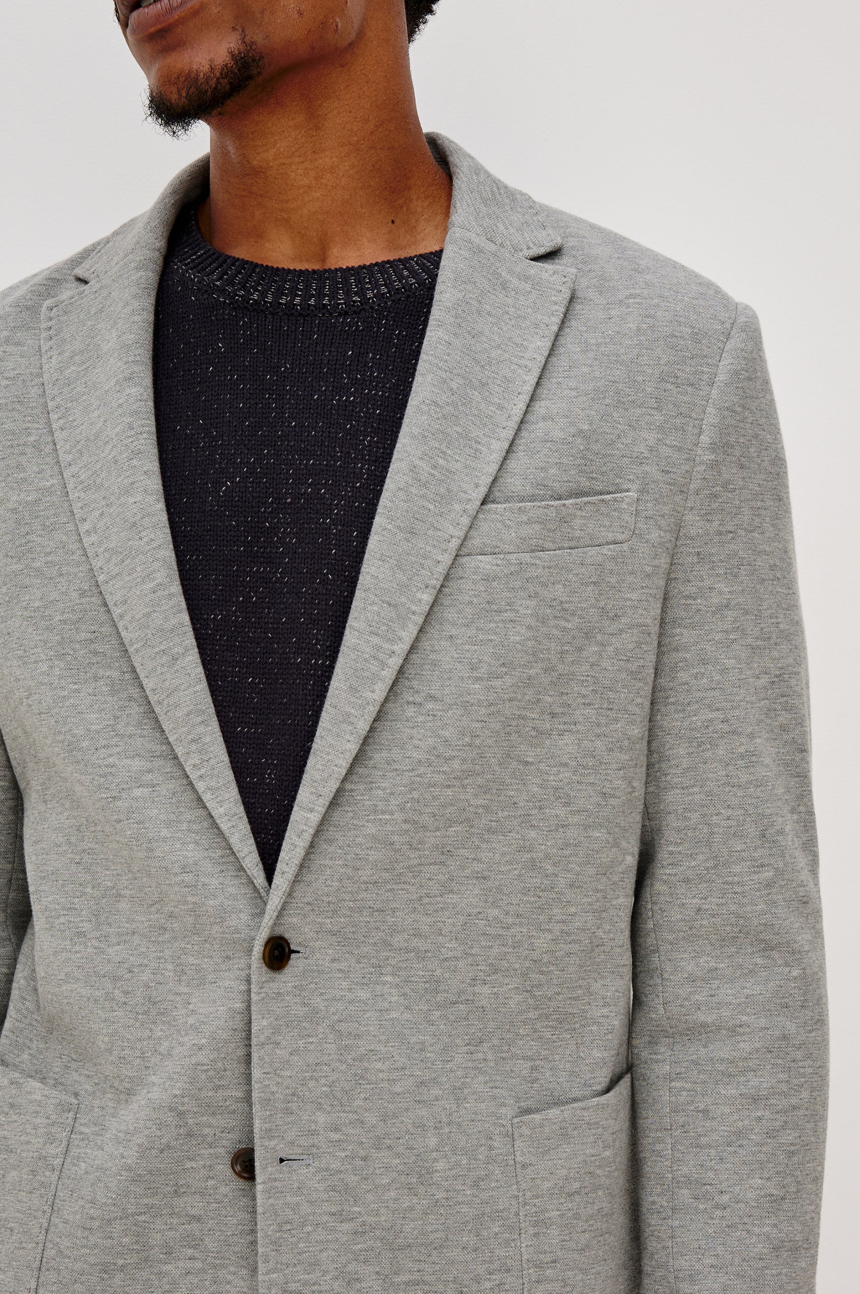Lorenz Single Breasted Blazer with two patch pockets and one chest pocket in Heather Grey Colorway. Front Detail View Shown on Model.