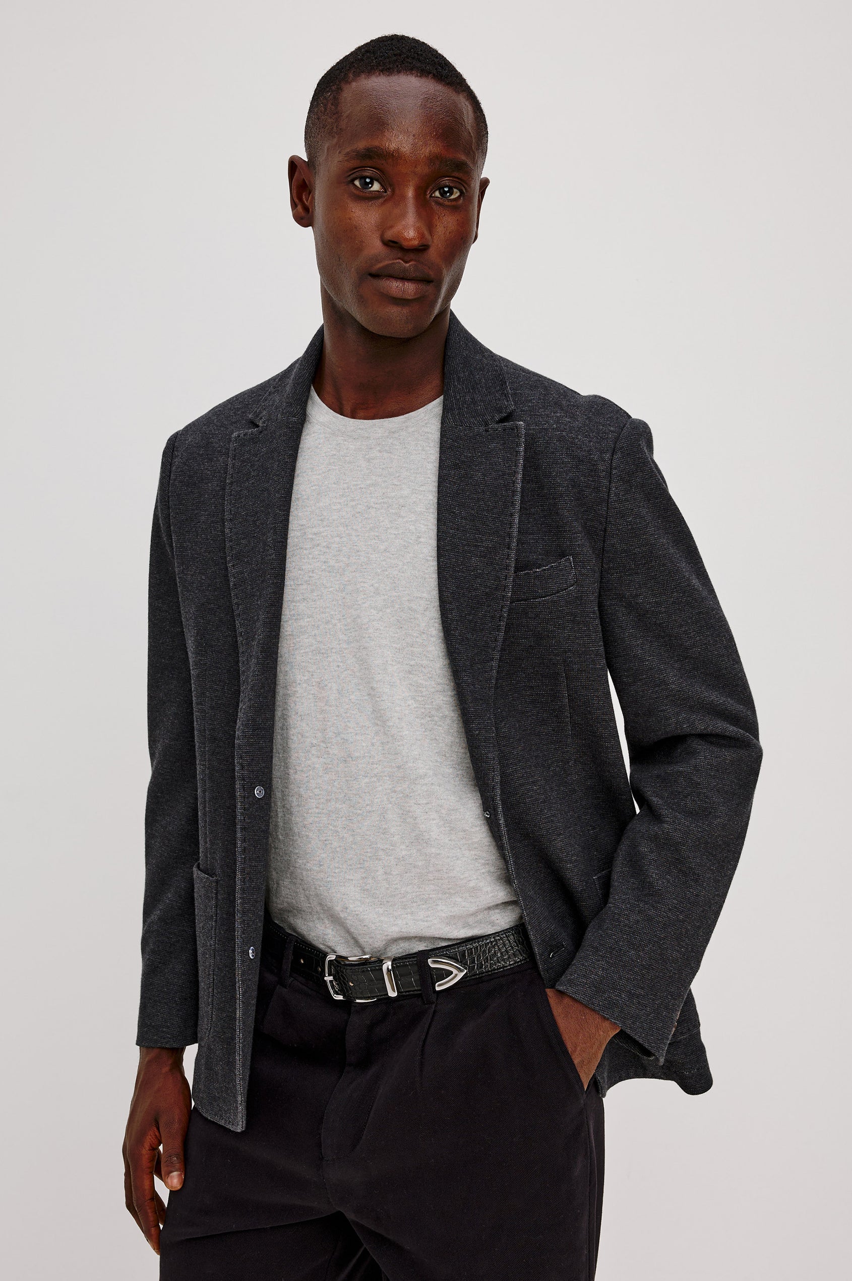 Lorenz Blazer in Ponte Jersey With Single-Breasted Design, Relaxed Fit, Jersey Lining, Notched Lapels, Chest Welt Pocket, Side Patch Pockets, Button-Cuff Long Sleeves, and Double Back Vents in Night Heather Colorway - Upper Body Front View Featured on Model