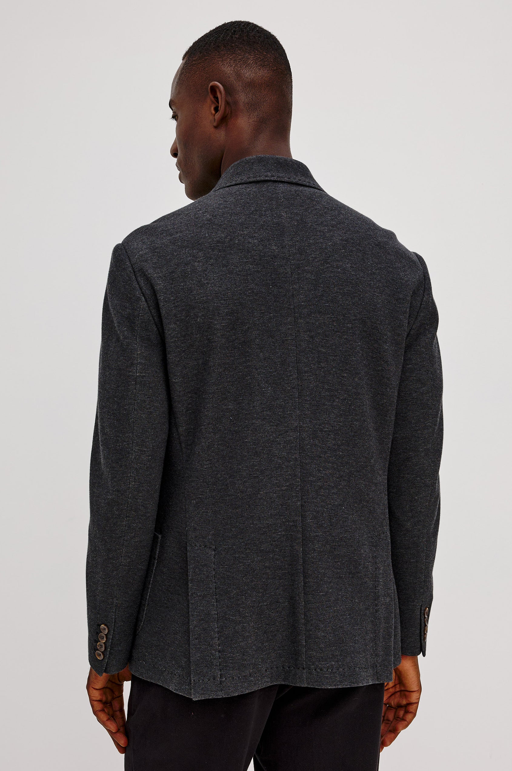 Lorenz Blazer in Ponte Jersey With Single-Breasted Design, Relaxed Fit, Jersey Lining, Notched Lapels, Chest Welt Pocket, Side Patch Pockets, Button-Cuff Long Sleeves, and Double Back Vents in Night Heather Colorway - Upper Body Back View Featured on Model