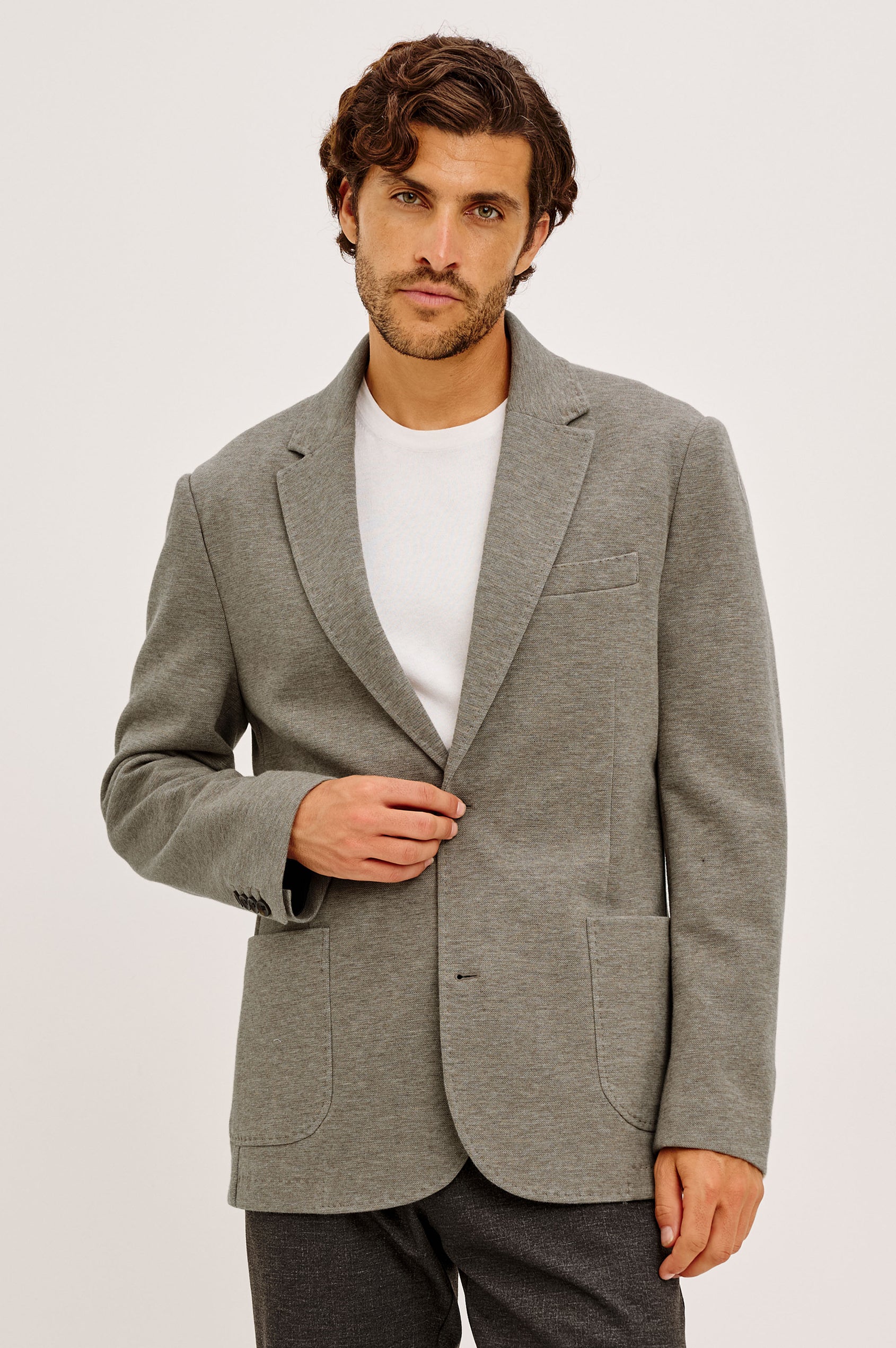 Lorenz Blazer in Ponte Jersey With Single-Breasted Design, Relaxed Fit, Jersey Lining, Notched Lapels, Chest Welt Pocket, Side Patch Pockets, Button-Cuff Long Sleeves, and Double Back Vents in Walnut Heather Colorway - Upper Body Front View Featured on Model