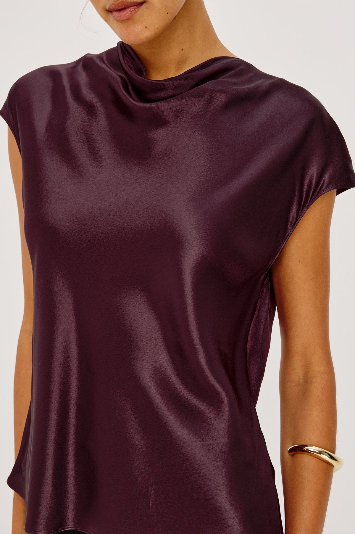 Loretta Top in Satin-Back Crepe With Cap Sleeve, Mock Neckline, Straight Hem, Keyhole Back, and Button-and-Loop Closure in Wine Colorway - Front Crop Detail View Featured on Model.