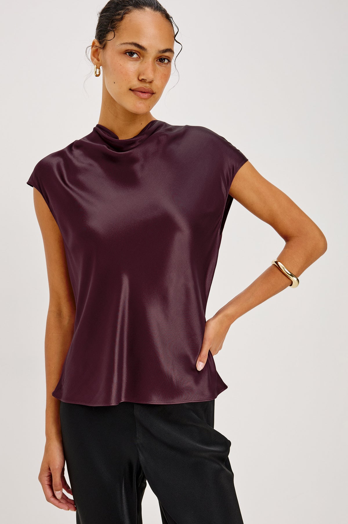 Loretta Top in Satin-Back Crepe With Cap Sleeve, Mock Neckline, Straight Hem, Keyhole Back, and Button-and-Loop Closure in Wine Colorway - Front Crop View Featured on Model.