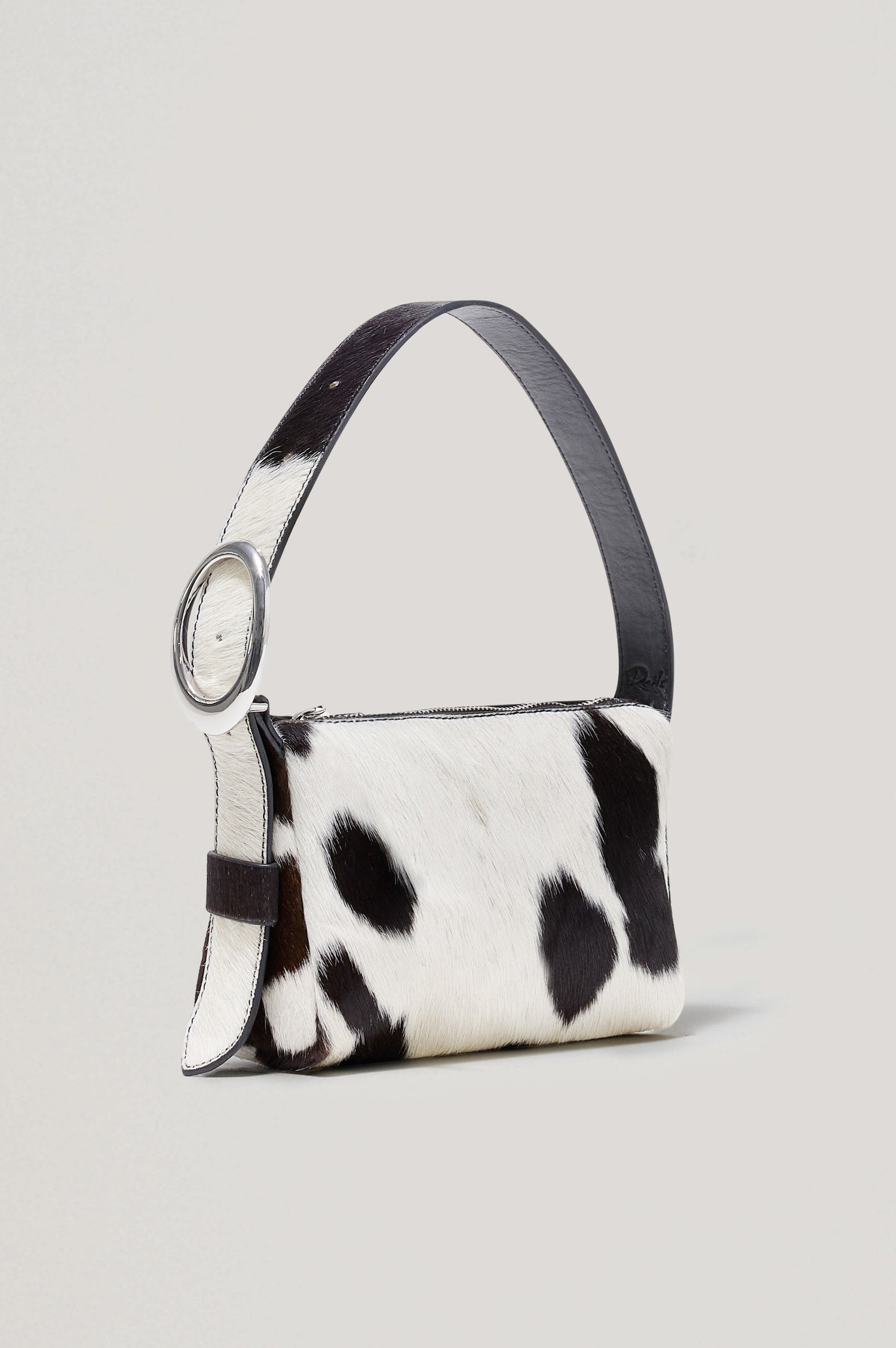 Lucca Shoulder Bag in Calfhair With Adjustable Strap and Polished Silver Buckle, Microsuede Lining, and Snap Button Interior Slip Pocket in Cowgirl Haircalf Colorway - Side View Featured