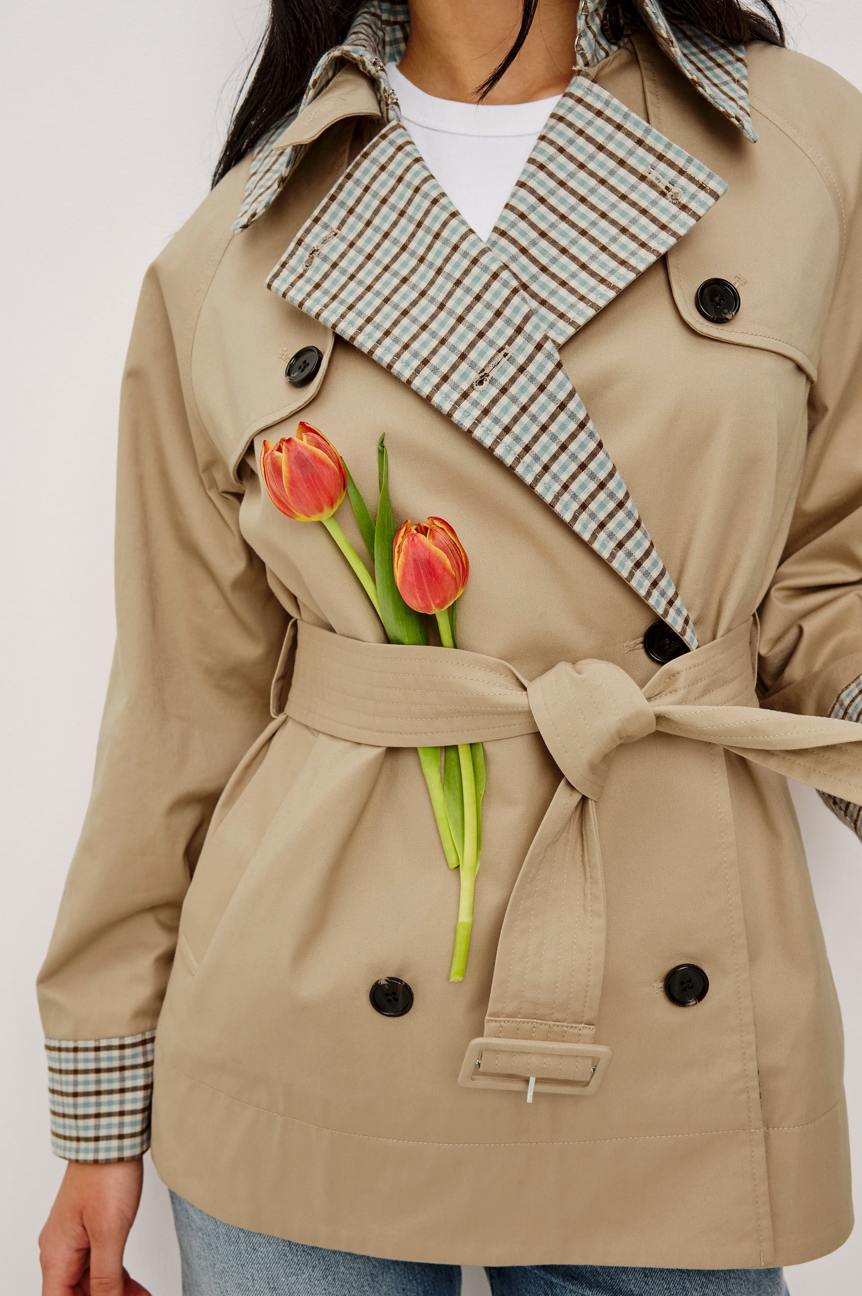 Lucien Trench Jacket in Garbardine With Notched Lapels, Wide 3/4 Sleeves, Double Breasted Buttons, Adjustable Belt, and Contrast Lining in Sand - Upper Body Front View Featured on Model