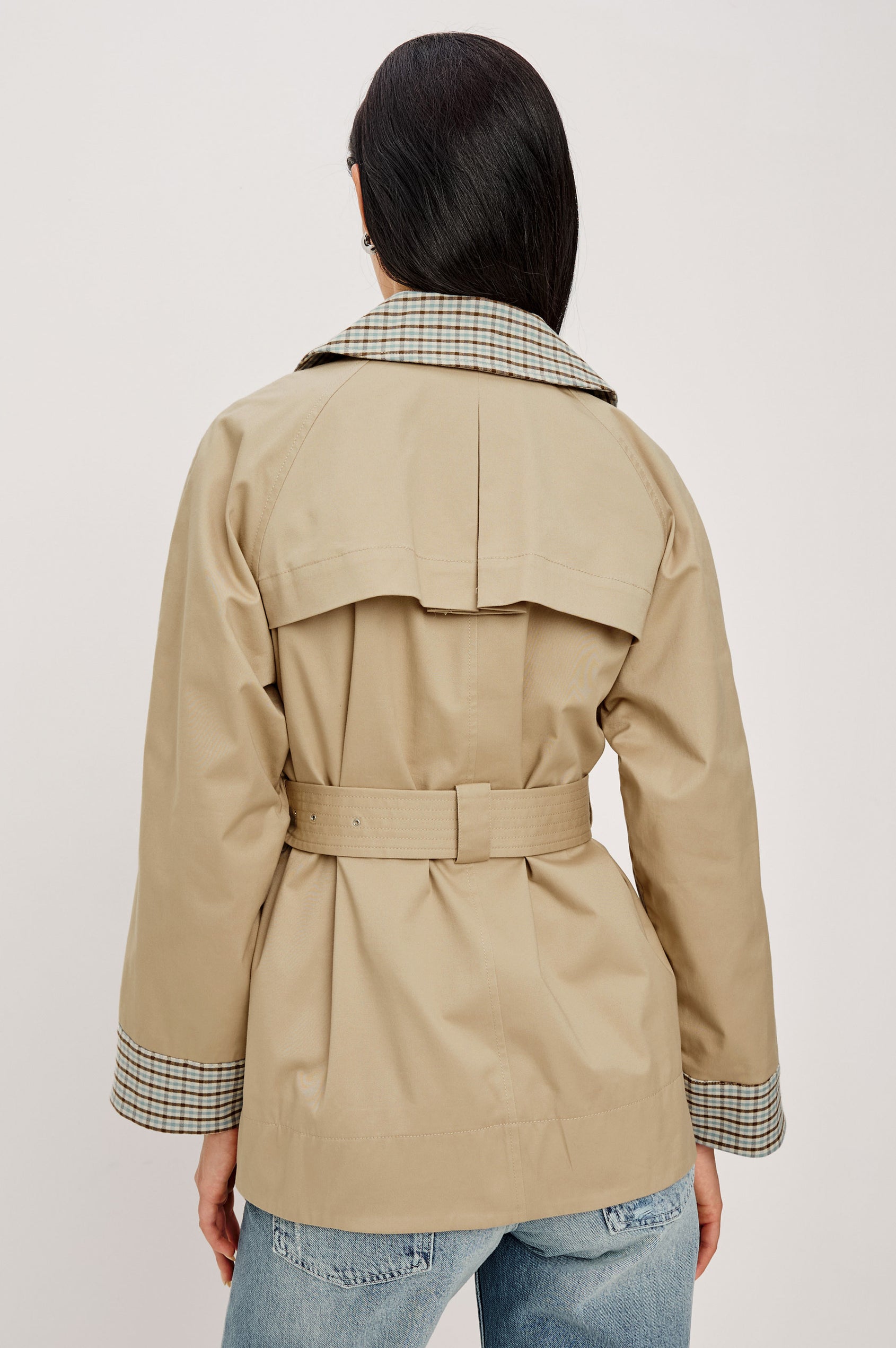 Lucien Trench Jacket in Garbardine With Notched Lapels, Wide 3/4 Sleeves, Double Breasted Buttons, Adjustable Belt, and Contrast Lining in Sand - Upper Body Back View Featured on Model