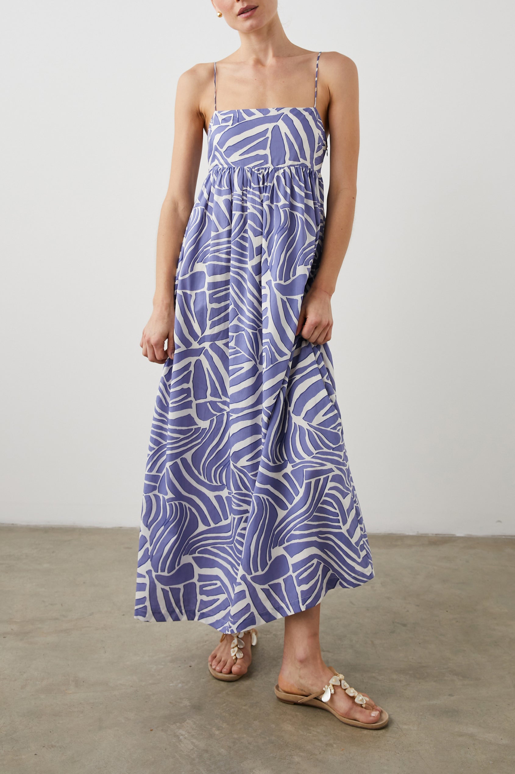 Lucille Sleeveless Maxi Dress with Adjustable Spaghetti Straps, a Square Neckline, and Shirring at the Back in Island Waves Colorway, a Purple and White Print - Front Full Body View Featured on Model  