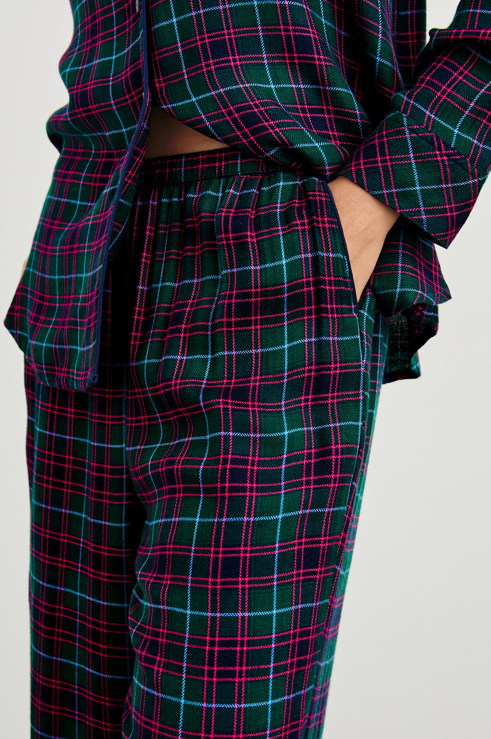 Luna Pajama Set with a Long Sleeve, Button Up, V Neck Top with a Chest Patch Pocket and Pants with Two Front Pockets in Evergreen Fuchsia Ice Colorway, a plaid - Front View Featured on Model  