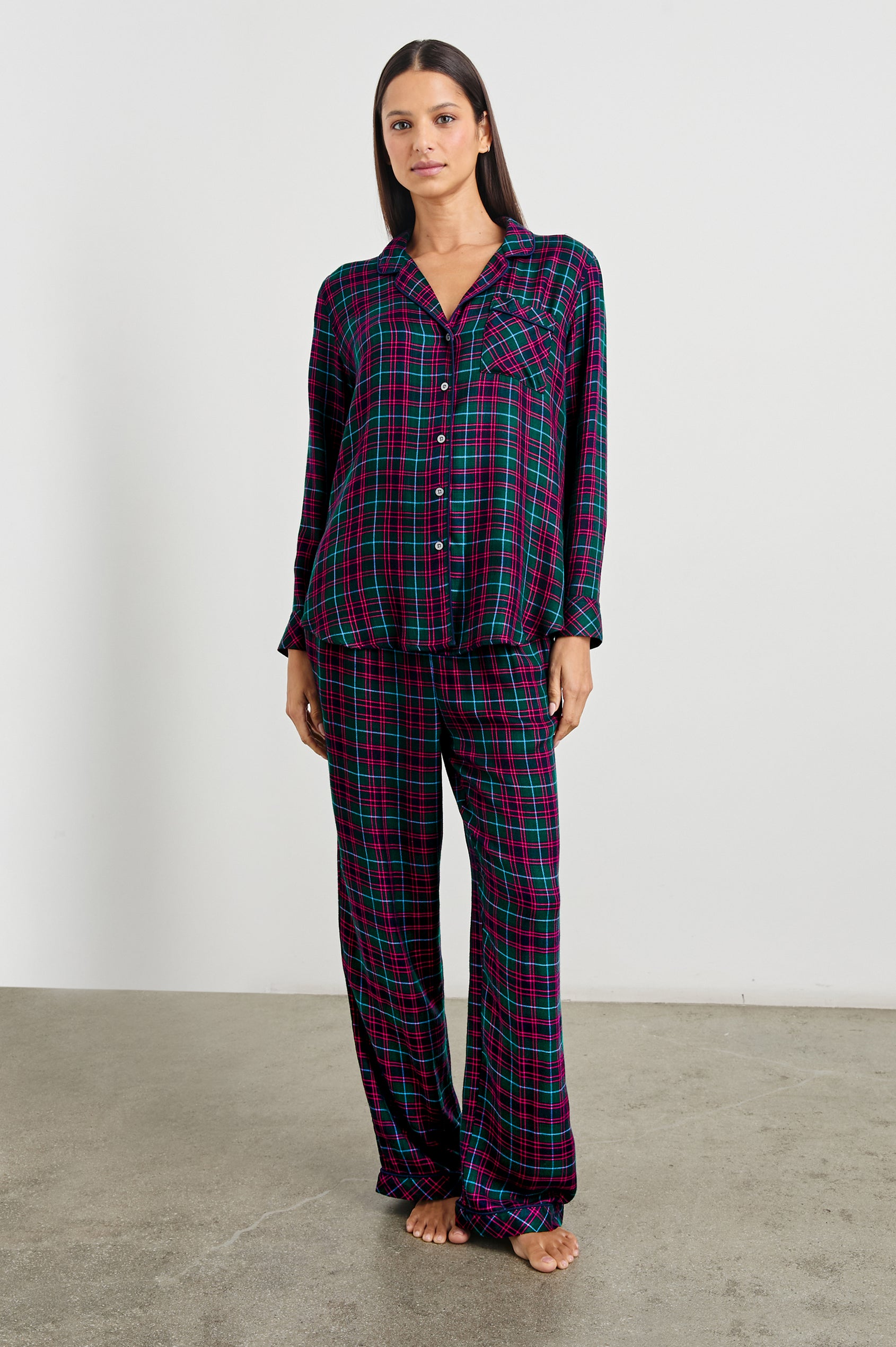 Luna Pajama Set with a Long Sleeve, Button Up, V Neck Top with a Chest Patch Pocket and Pants with Two Front Pockets in Evergreen Fuchsia Ice Colorway, a plaid - Front Full Body View Featured on Model  