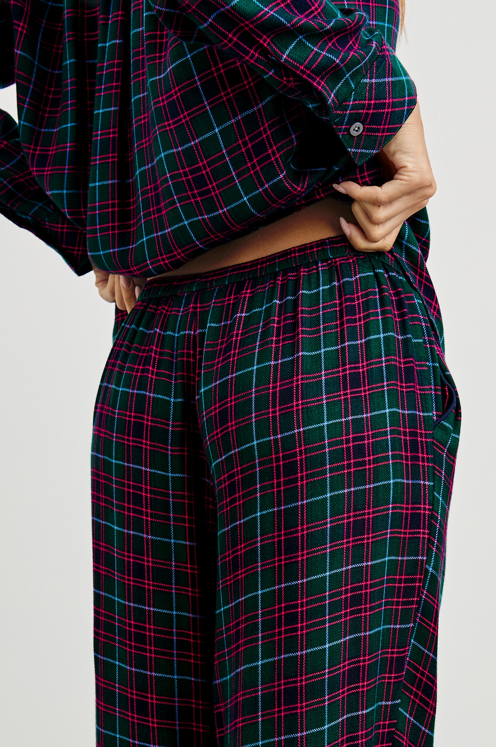 Luna Pajama Set with a Long Sleeve, Button Up, V Neck Top with a Chest Patch Pocket and Pants with Two Front Pockets in Evergreen Fuchsia Ice Colorway, a plaid - Back View Featured on Model  