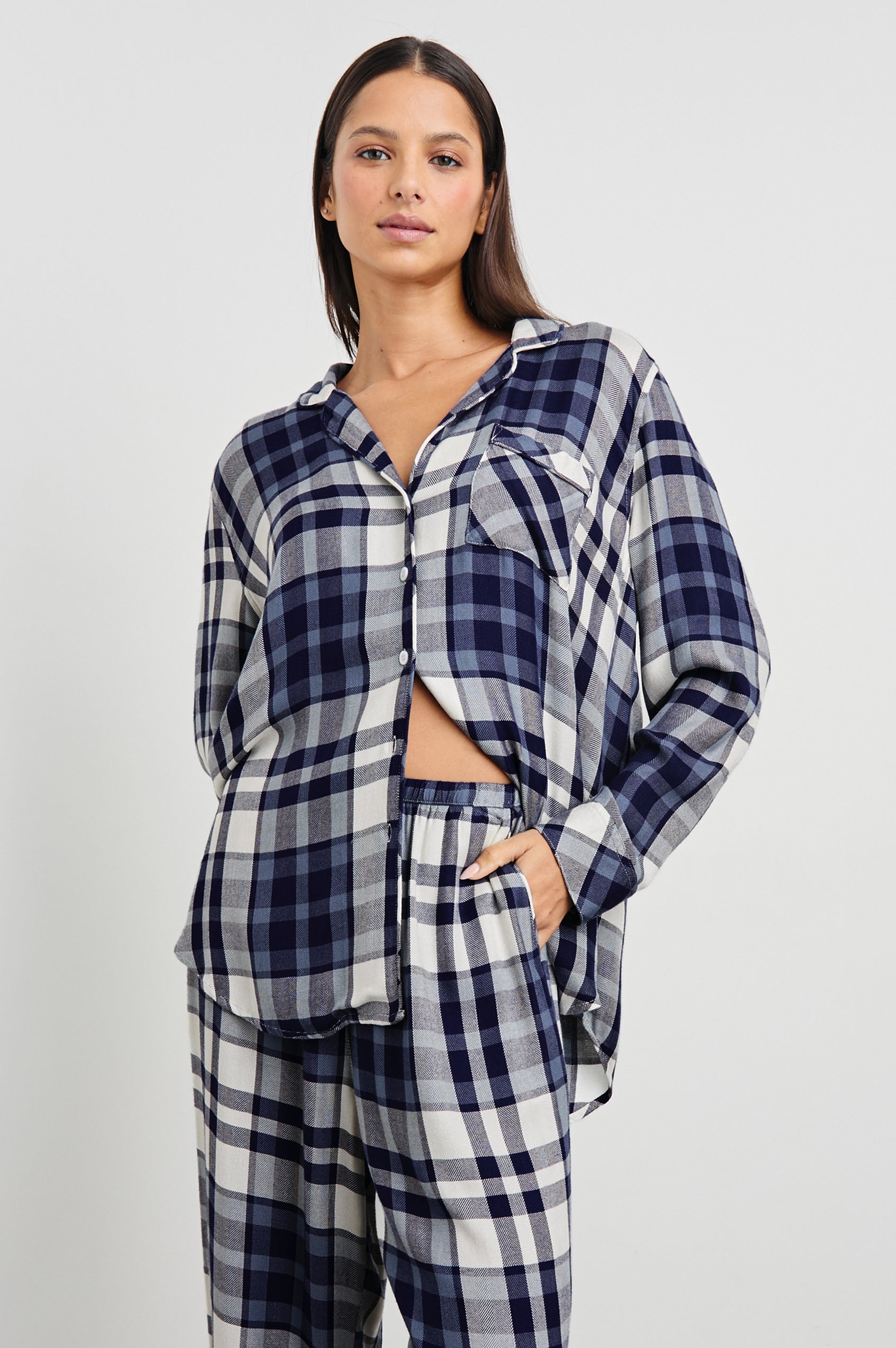 Luna Pajama Set with a Long Sleeve, Button Up, V Neck Top with a Chest Patch Pocket and Pants with Two Front Pockets in Lake Blue Cloud Colorway, a plaid - Front View Featured on Model  