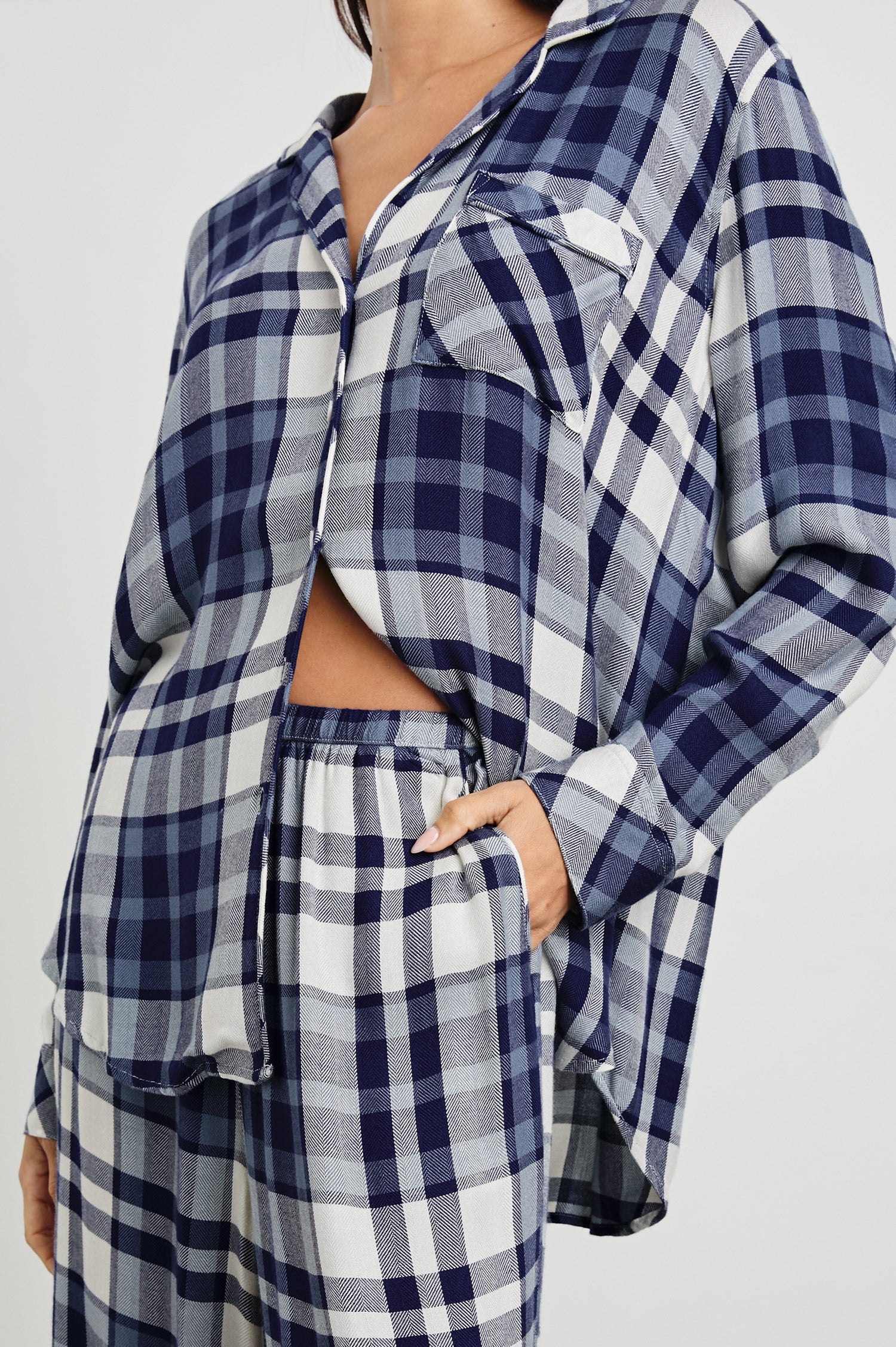 Luna Pajama Set with a Long Sleeve, Button Up, V Neck Top with a Chest Patch Pocket and Pants with Two Front Pockets in Lake Blue Cloud Colorway, a plaid - Front View Featured on Model  