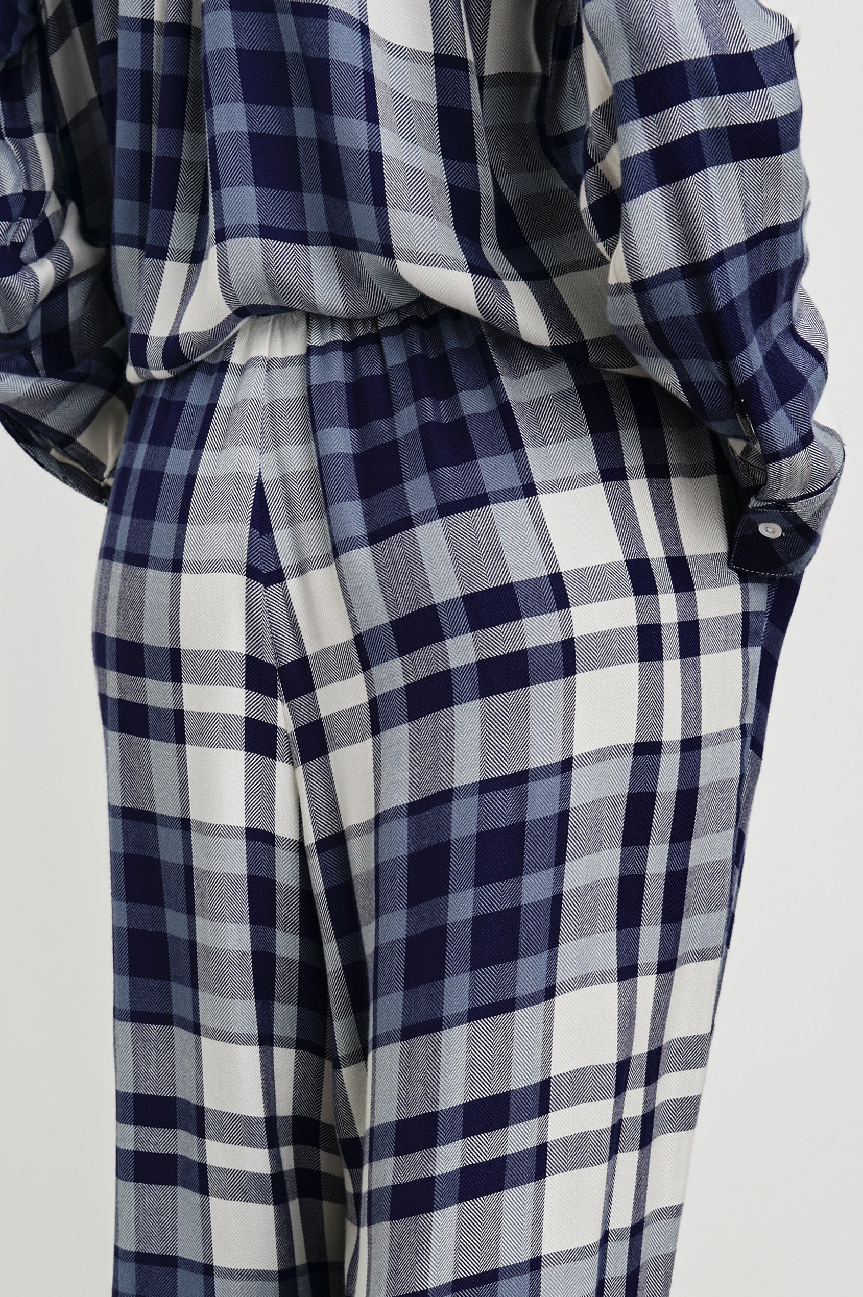 Luna Pajama Set with a Long Sleeve, Button Up, V Neck Top with a Chest Patch Pocket and Pants with Two Front Pockets in Lake Blue Cloud Colorway, a plaid - Back View Featured on Model  