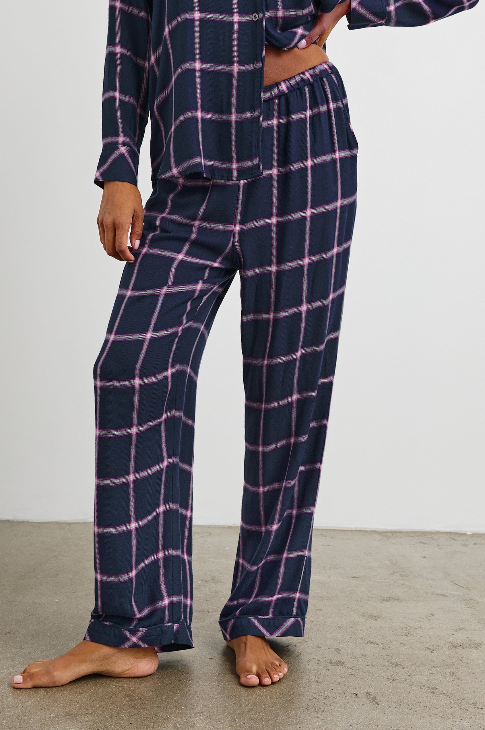 Luna Pajama Set with a Long Sleeve, Button Up, V Neck Top with a Chest Patch Pocket and Pants with Two Front Pockets in Sapphire Magenta Colorway, a plaid - Front View Featured on Model  