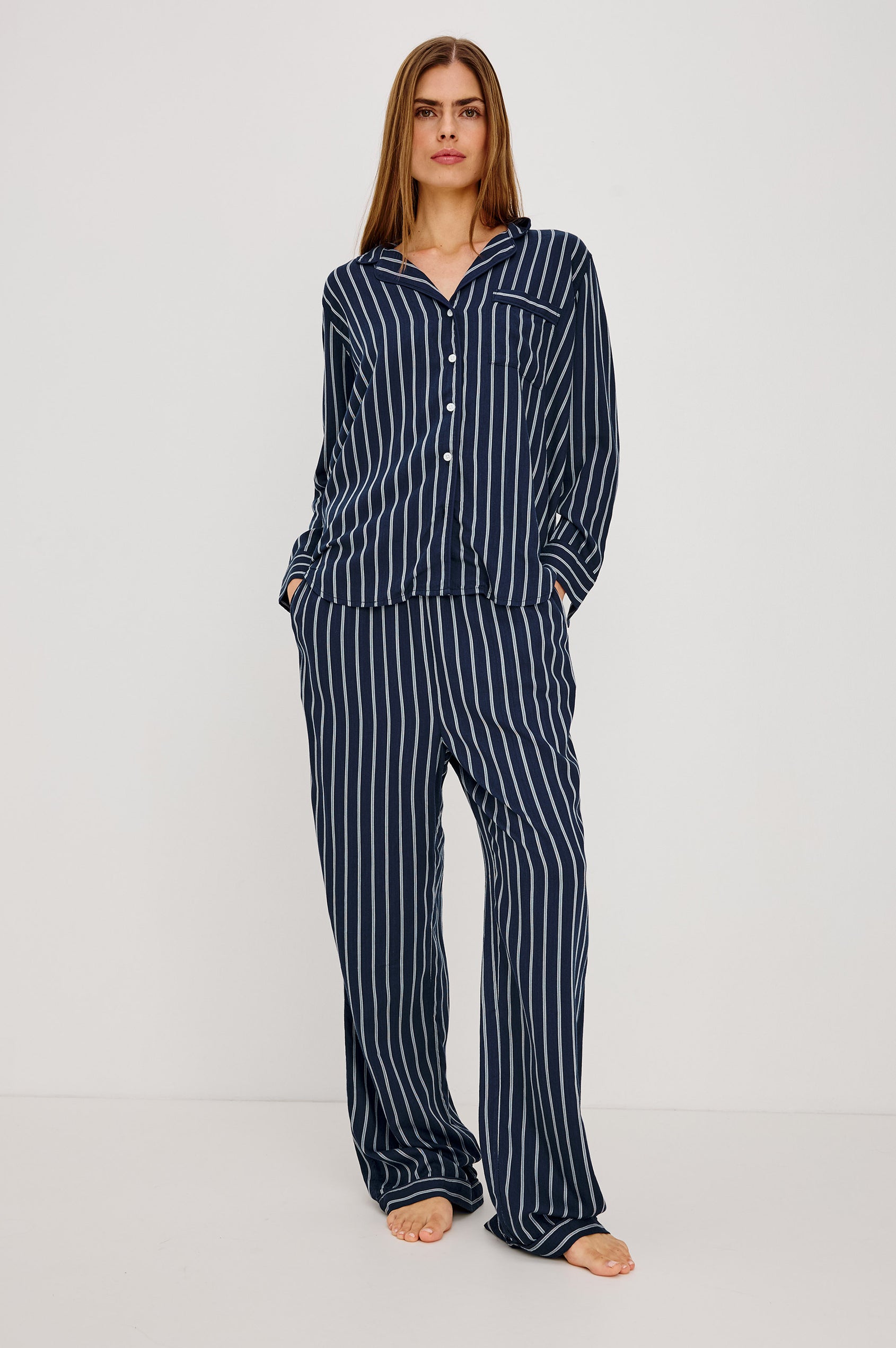 Luna Pajama Set in Signature Rayon With Piping, Button-Up Shirt, Matching Pants, and Relaxed Fit in Navy Sky Stripe Colorway - Full Body Front View Featured on Model