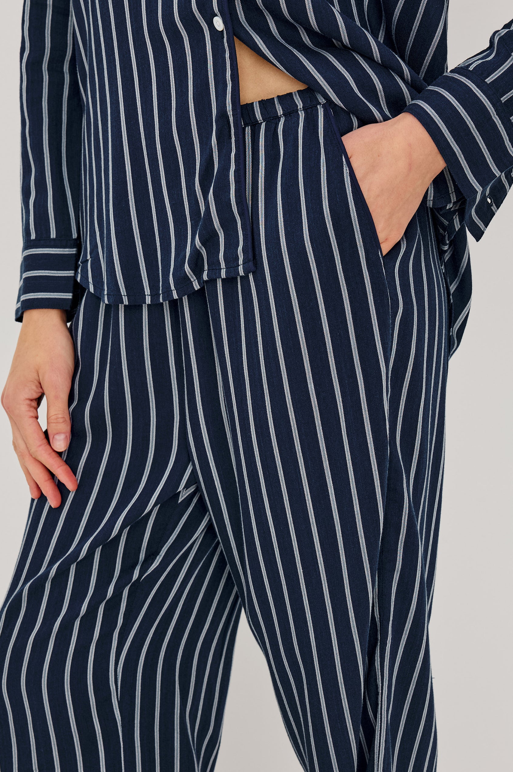 Luna Pajama Set in Signature Rayon With Piping, Button-Up Shirt, Matching Pants, and Relaxed Fit in Navy Sky Stripe Colorway - Lower Body Close Up View Featured on Model