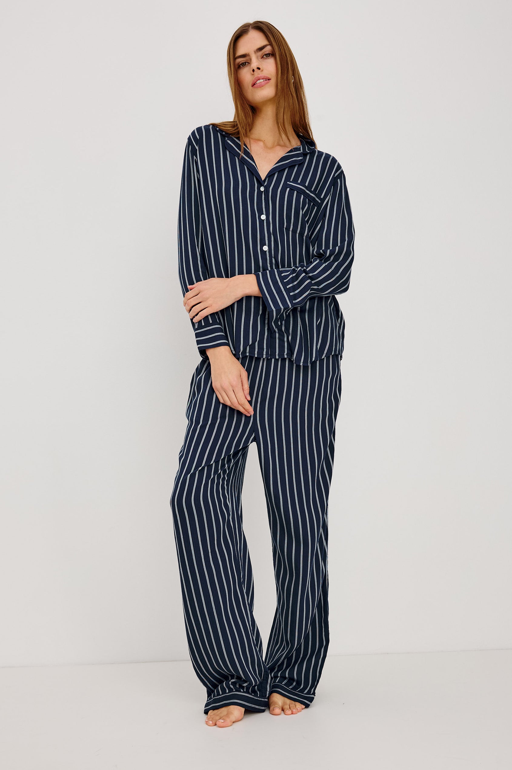 Luna Pajama Set in Signature Rayon With Piping, Button-Up Shirt, Matching Pants, and Relaxed Fit in Navy Sky Stripe Colorway - Full Body Front View Featured on Model