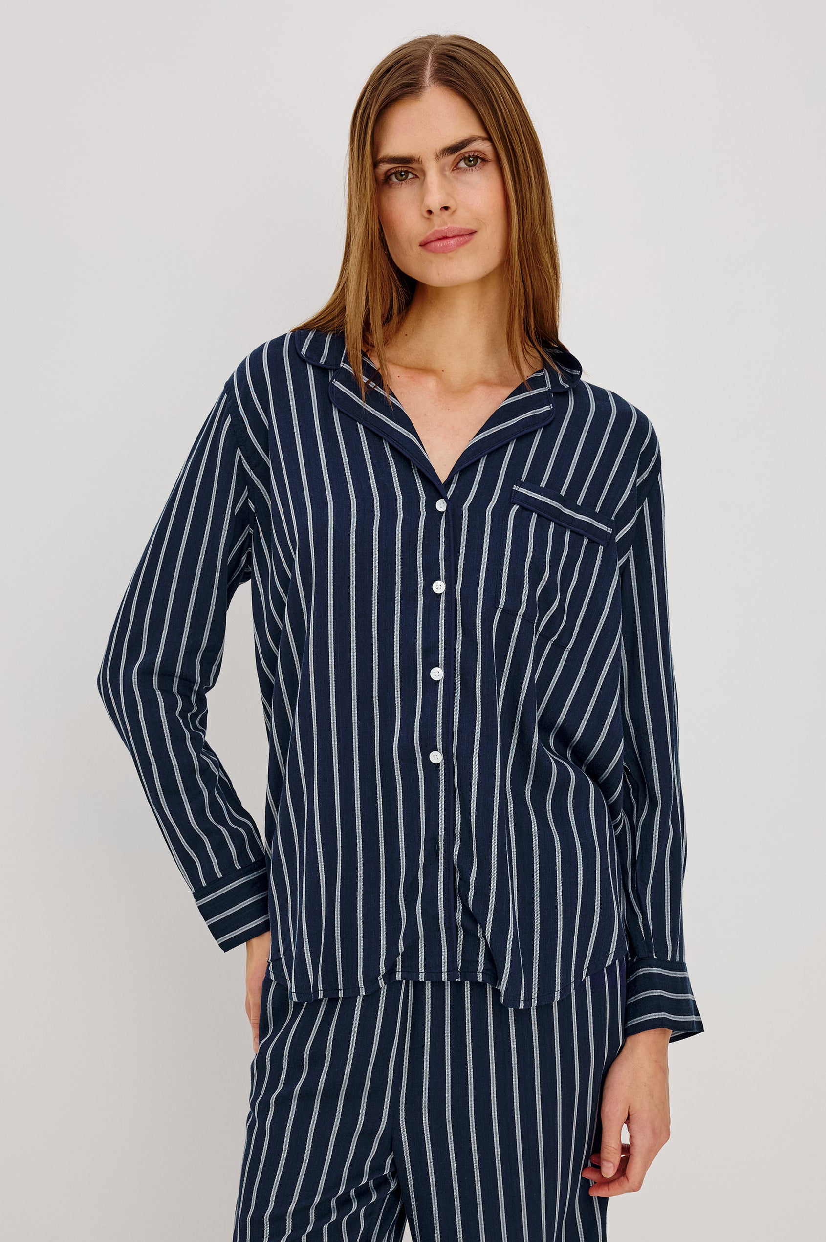 Luna Pajama Set in Signature Rayon With Piping, Button-Up Shirt, Matching Pants, and Relaxed Fit in Navy Sky Stripe Colorway - Upper Body Front View Featured on Model