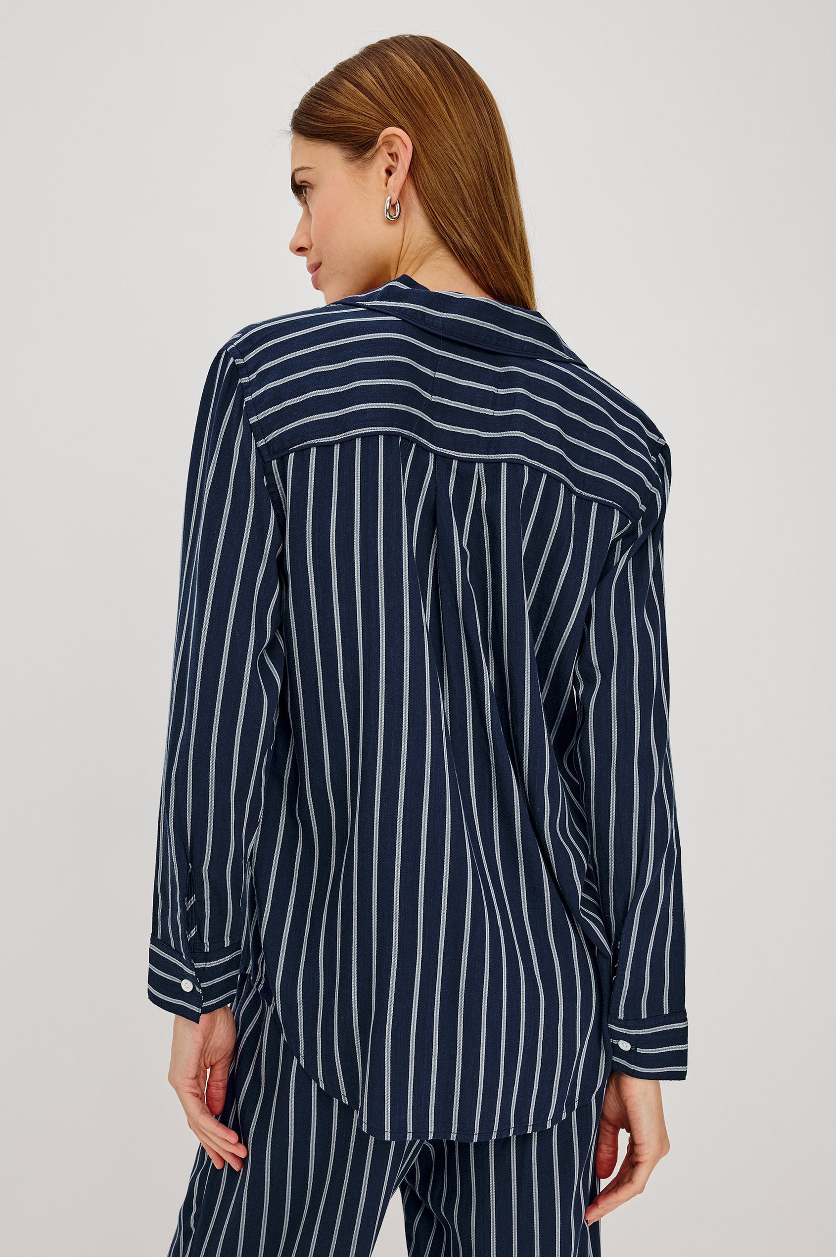 Luna Pajama Set in Signature Rayon With Piping, Button-Up Shirt, Matching Pants, and Relaxed Fit in Navy Sky Stripe Colorway - Upper Body Back View Featured on Model