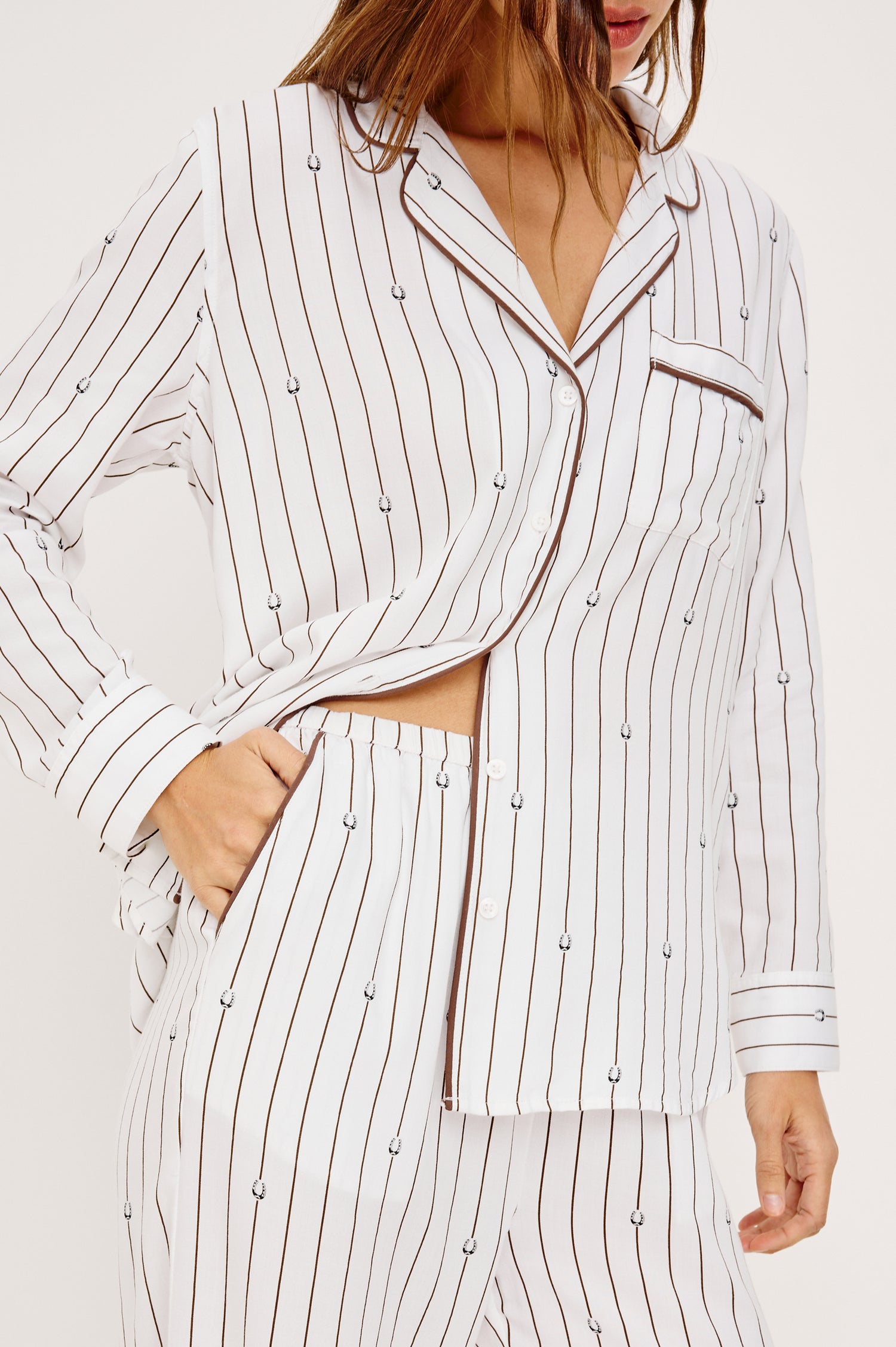 Luna Pajama Set in Signature Rayon With Button-Up Collared Shirt With Front Buttons, Long Sleeves, Chest Patch Pocket and Matching Pants With Side Pockets and Drawstring Waist Ties in Striped Lucky Horseshoes Colorway - Upper Body Close Up Front View Featured on Model