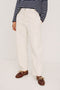 Lunar Pant in Stretch Corduroy With Relaxed Straight Legs, Zip-Fly Closure, Belt Loops, Seam Detailing, Carpenter-Style Side Pockets, and Back Pockets in Bone Colorway - Lower Body Front View Featured on Model