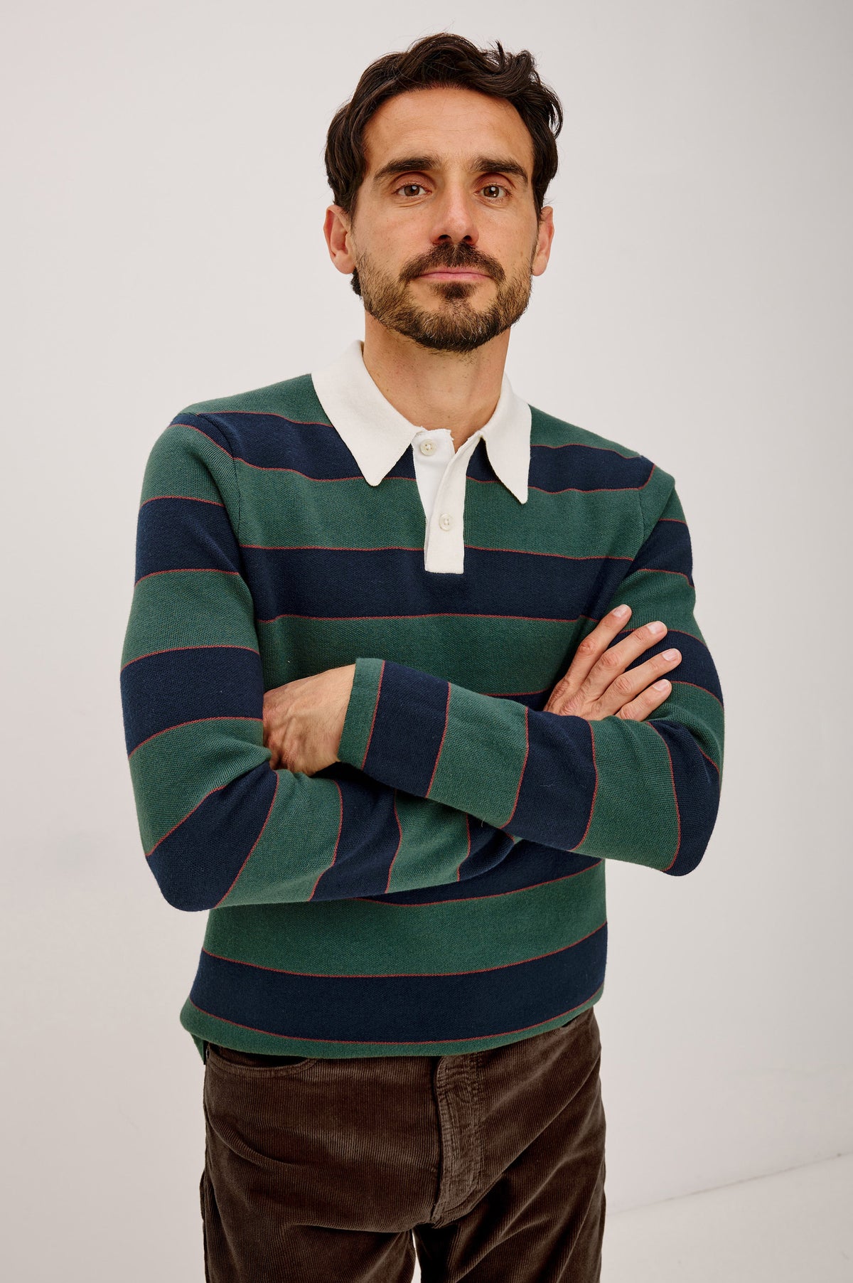 Luther Sweater in Striped Knit With Contrast Collar, Quarter-Button Placket, and Long Sleeves in Tartan Border Stripe Colorway - Front View Featured on Model.