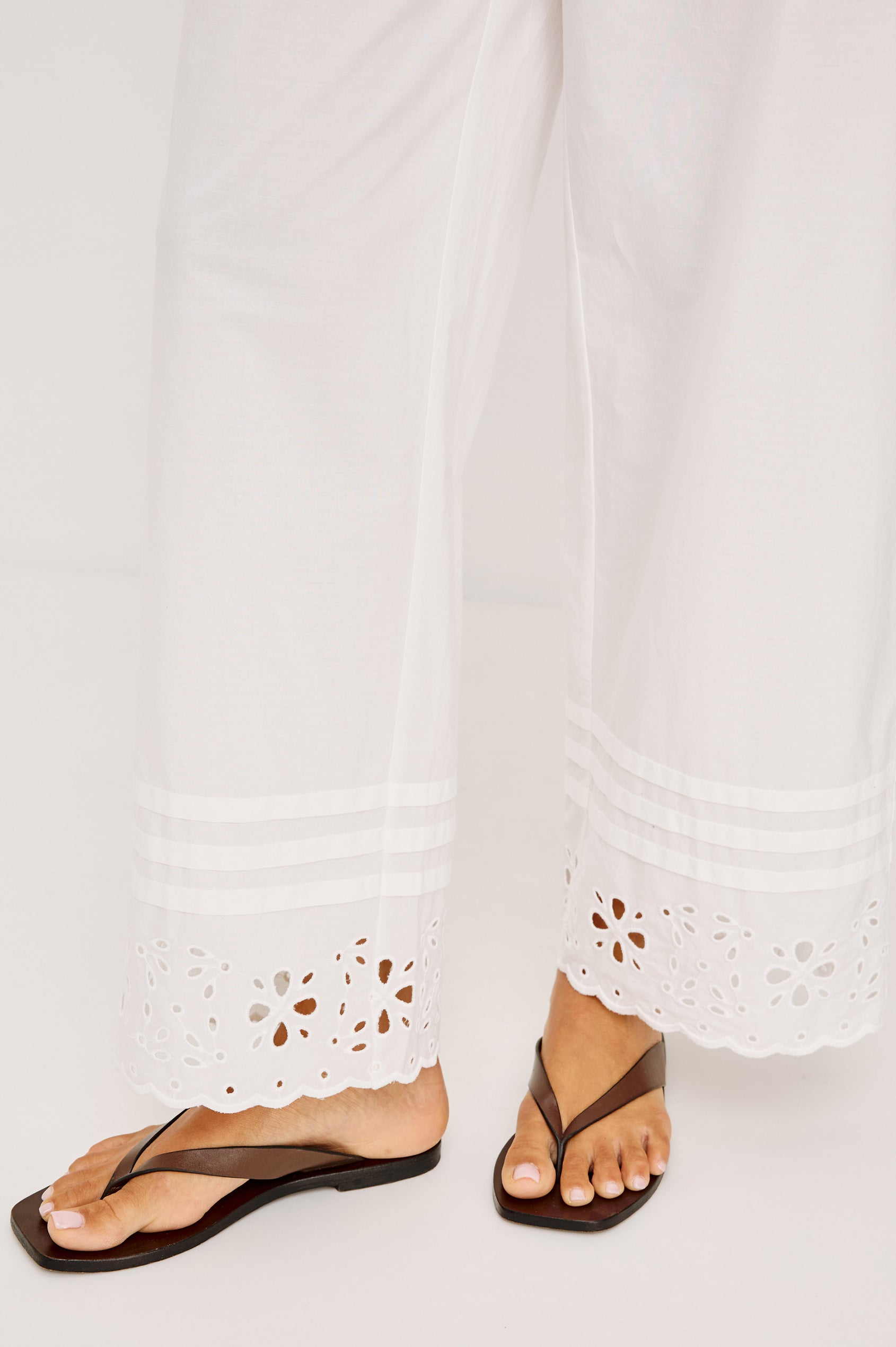 Lydia Mid-Rise Straight Leg Pant in Cotton Poplin With Adjustable Drawcords, and Eyelet Embroidery in White Colorway - Lower Body Front View Featured on Model