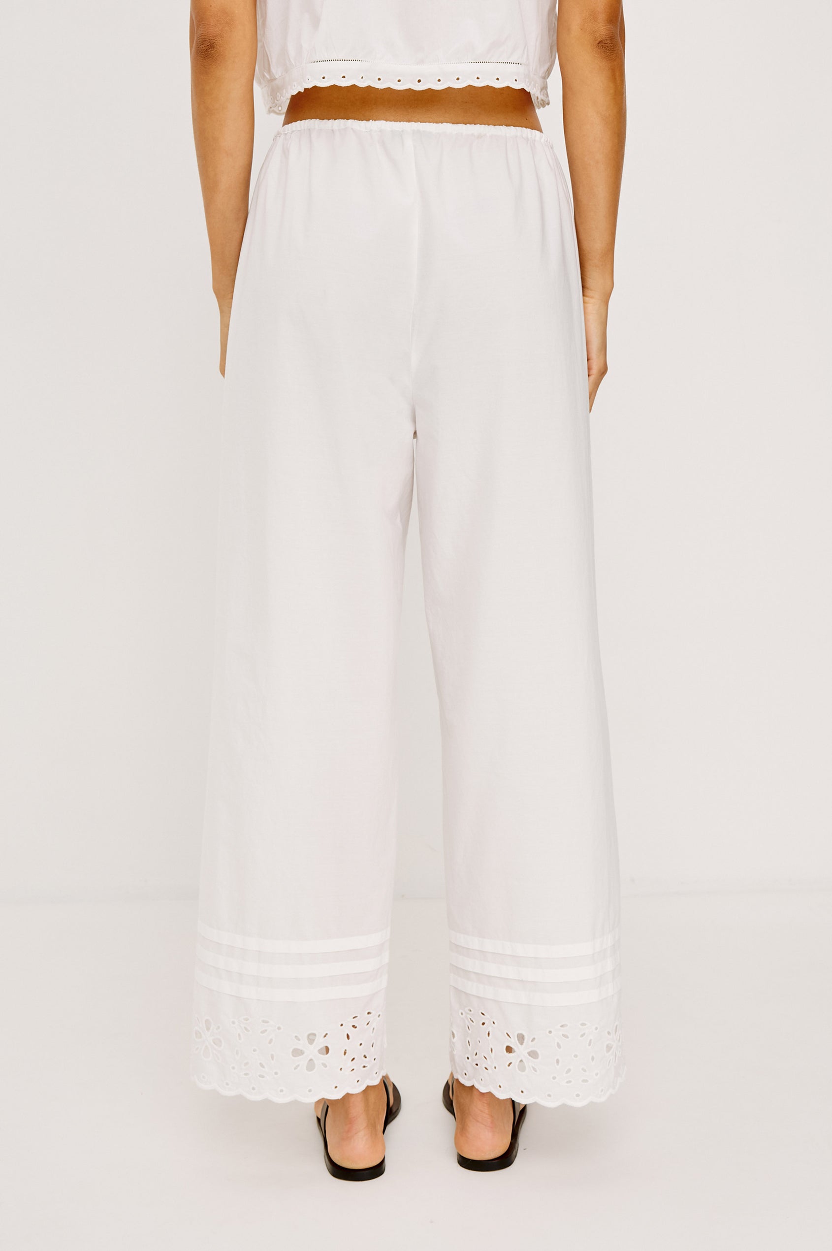 Lydia Mid-Rise Straight Leg Pant in Cotton Poplin With Adjustable Drawcords, and Eyelet Embroidery in White Colorway - Lower Body Back View Featured on Model