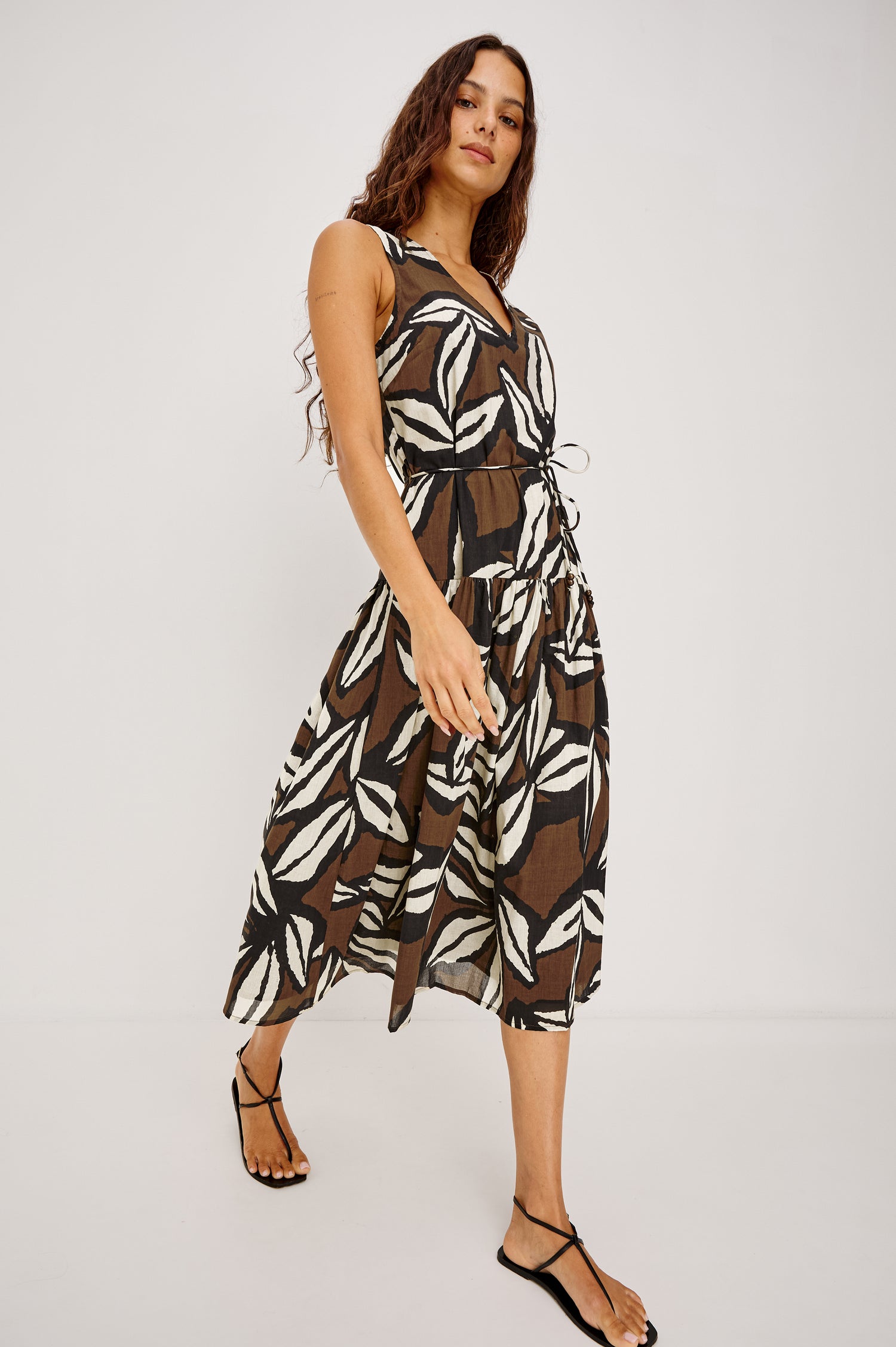 Maeve Midi Dress in Cotton Voile With V-Neckline, Adjustable Belted Ties, A-Line Silhouette, Drop Waist, Tiered Skirt, and Side Seam Zipper in Cocoa Floral Colorway - Full Body Front View Featured on Model