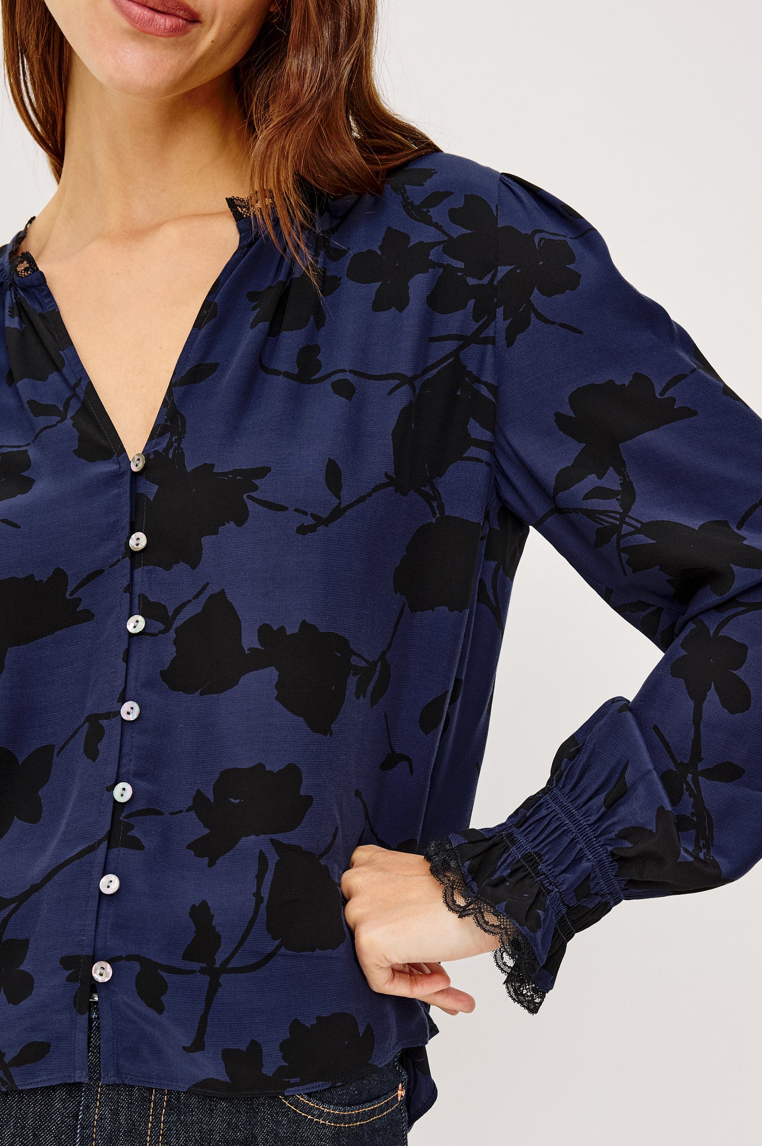 Magda Blouse in Rayon Crepe With V-Neckline, Front Shell Buttons, Lace Trim, and Long Puff Sleeves With Smocked Cuffs in Navy Tossed Roses Colorway - Upper Body Front View Featured on Model