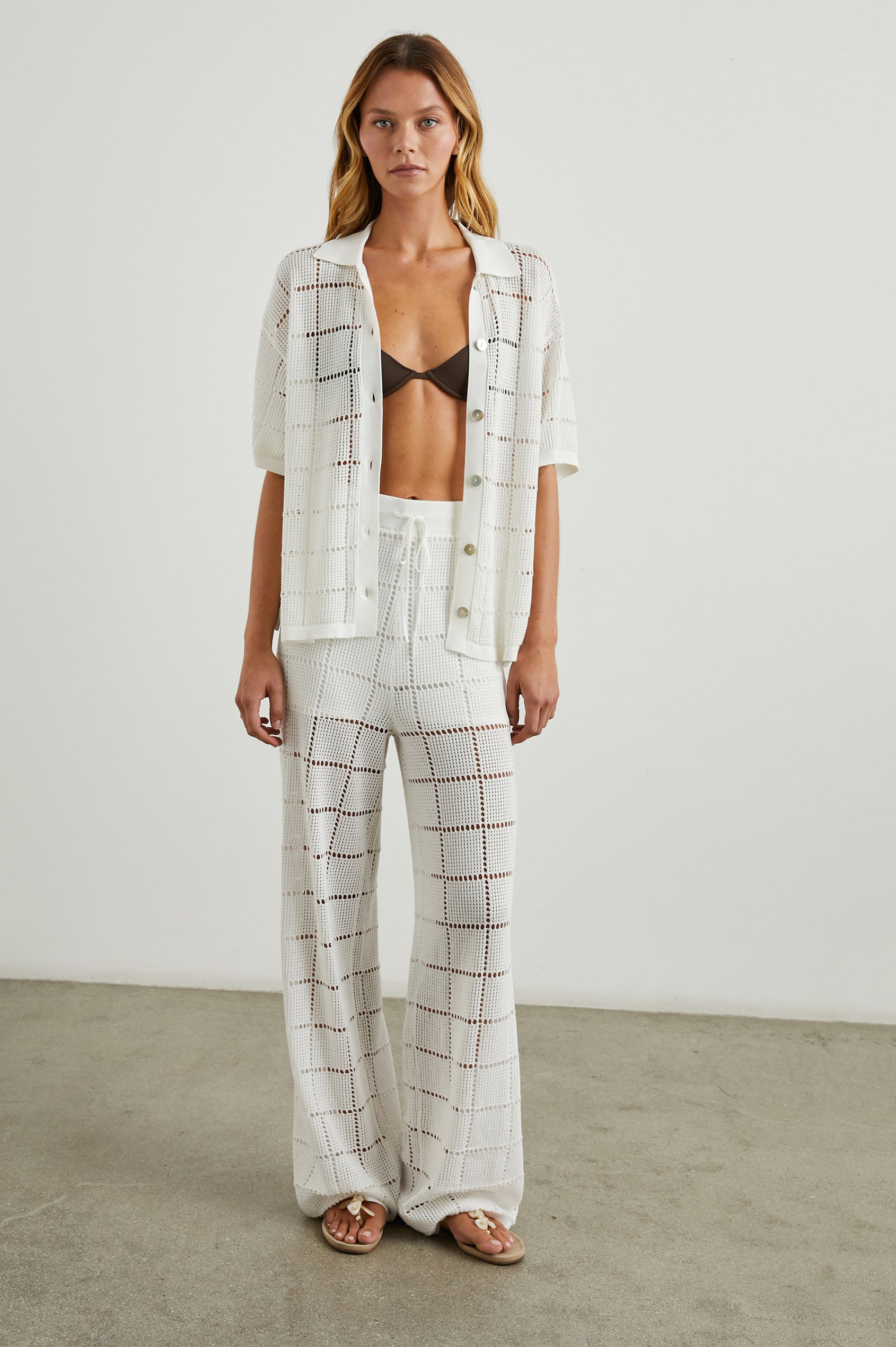 Maja Pants with a Drawstring Waist, an Open Stitch Grid Design, with a Shorts Underlayer in White Colorway - Front Full Body View Featured on Model 