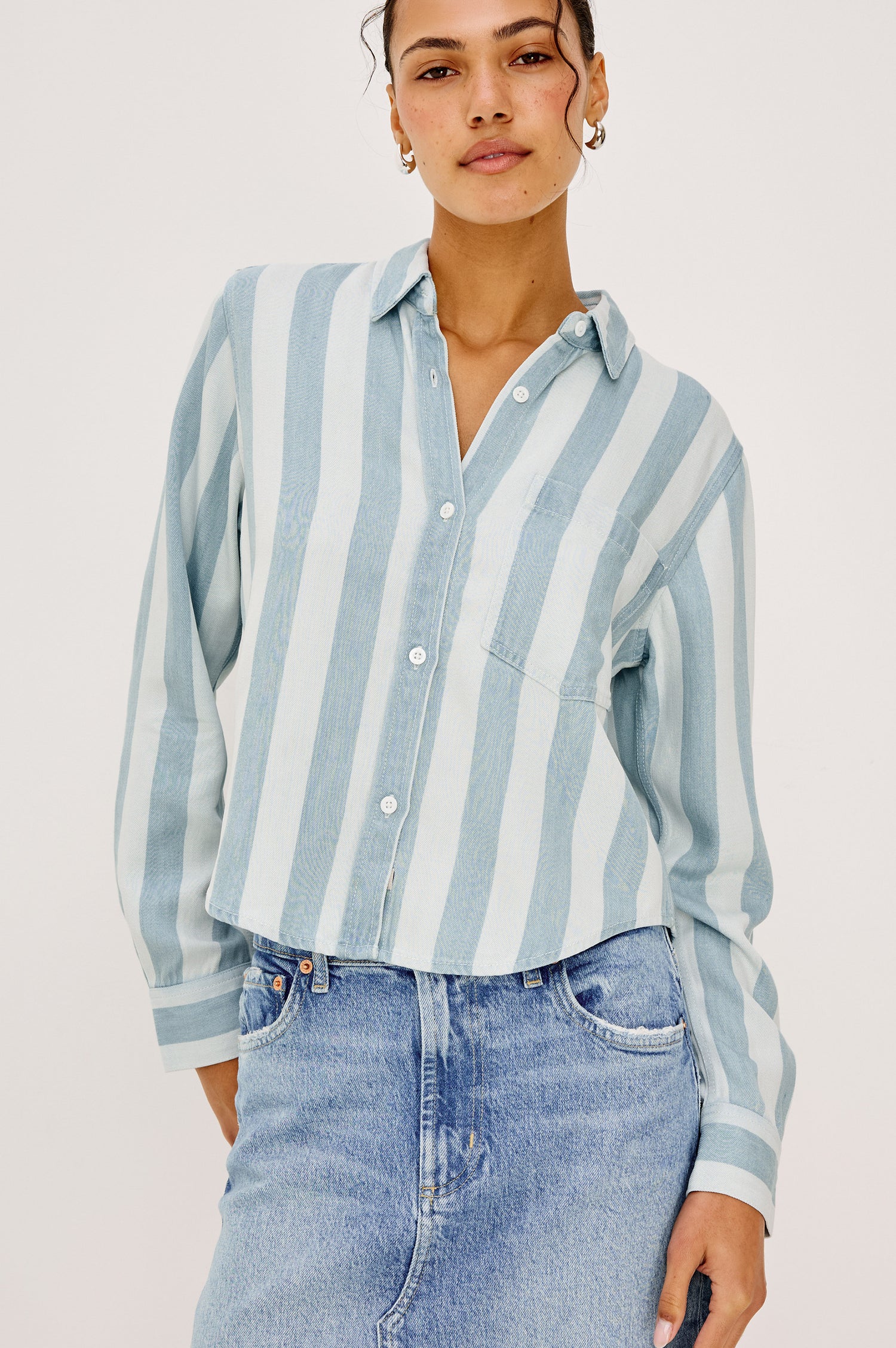 Malin Cropped Boxy Shirt in Signature Soft Rayon With Loose Twill Weave With Collar, Front Buttons, Long Sleeves, Chest Patch Pocket in White and Blue Stripe Colorway - Upper Body Front View Featured on Model