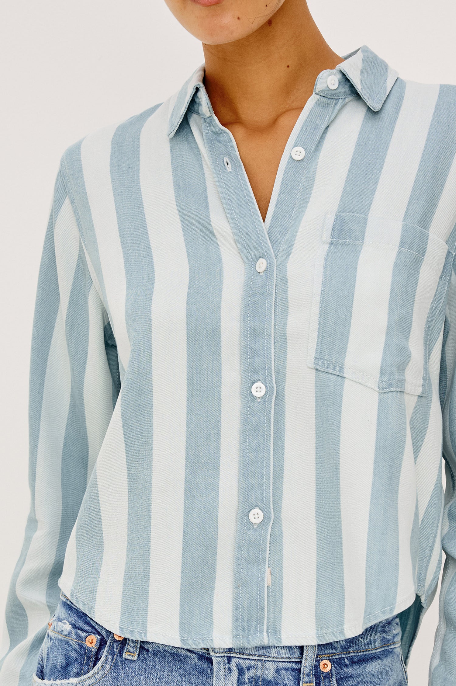 Malin Cropped Boxy Shirt in Signature Soft Rayon With Loose Twill Weave With Collar, Front Buttons, Long Sleeves, Chest Patch Pocket in White and Blue Stripe Colorway - Upper Body Front View Zoomed In Details Featured on Model