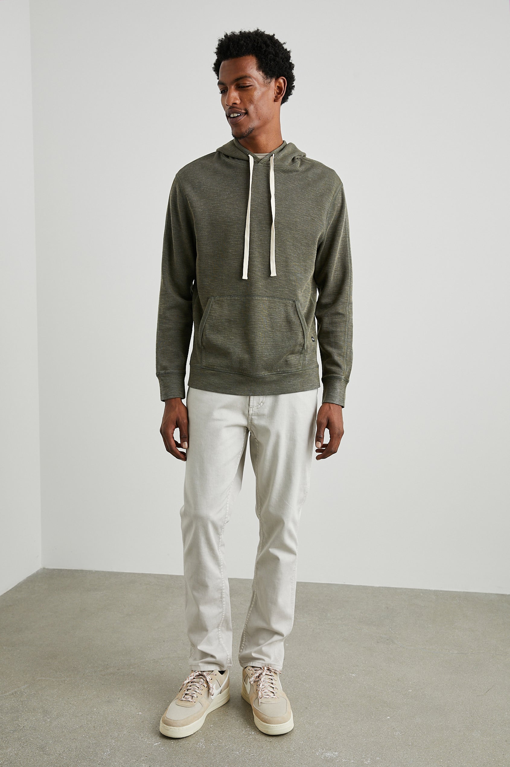 Mammoth Long-Sleeve Hoodie with a Kangaroo Pocket and Drawstring Hood in Surplus Colorway - Front Full Body View Featured on Model
