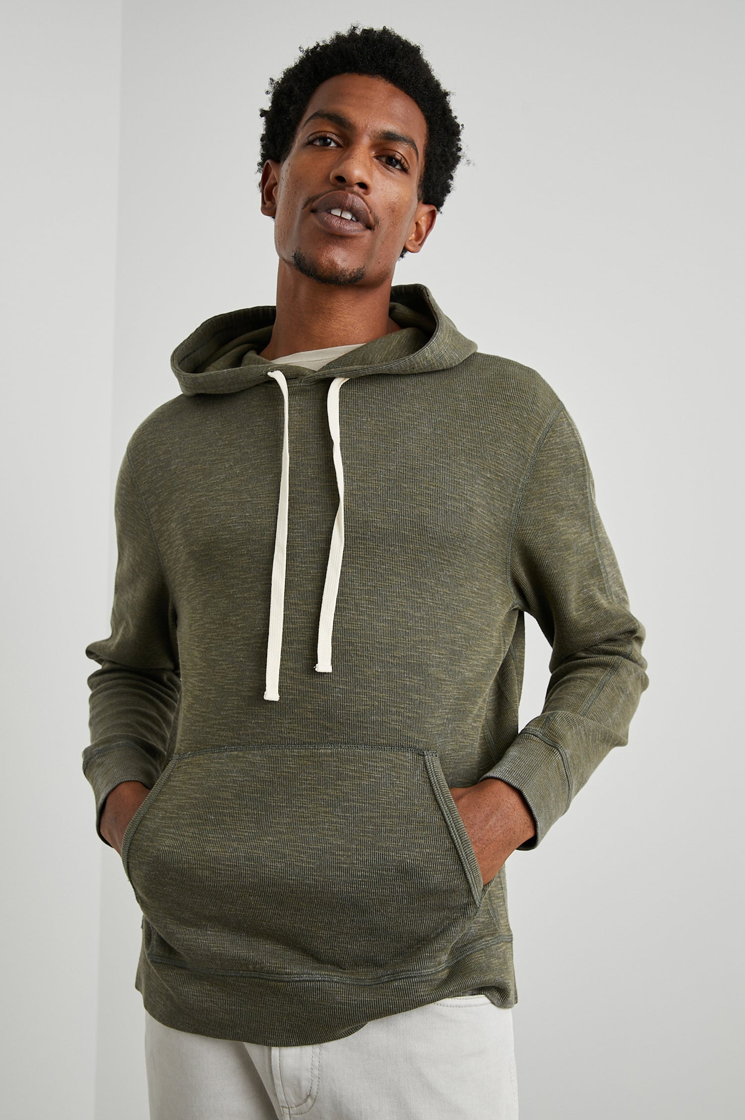 Mammoth Long-Sleeve Hoodie with a Kangaroo Pocket and Drawstring Hood in Surplus Colorway - Front View Featured on Model