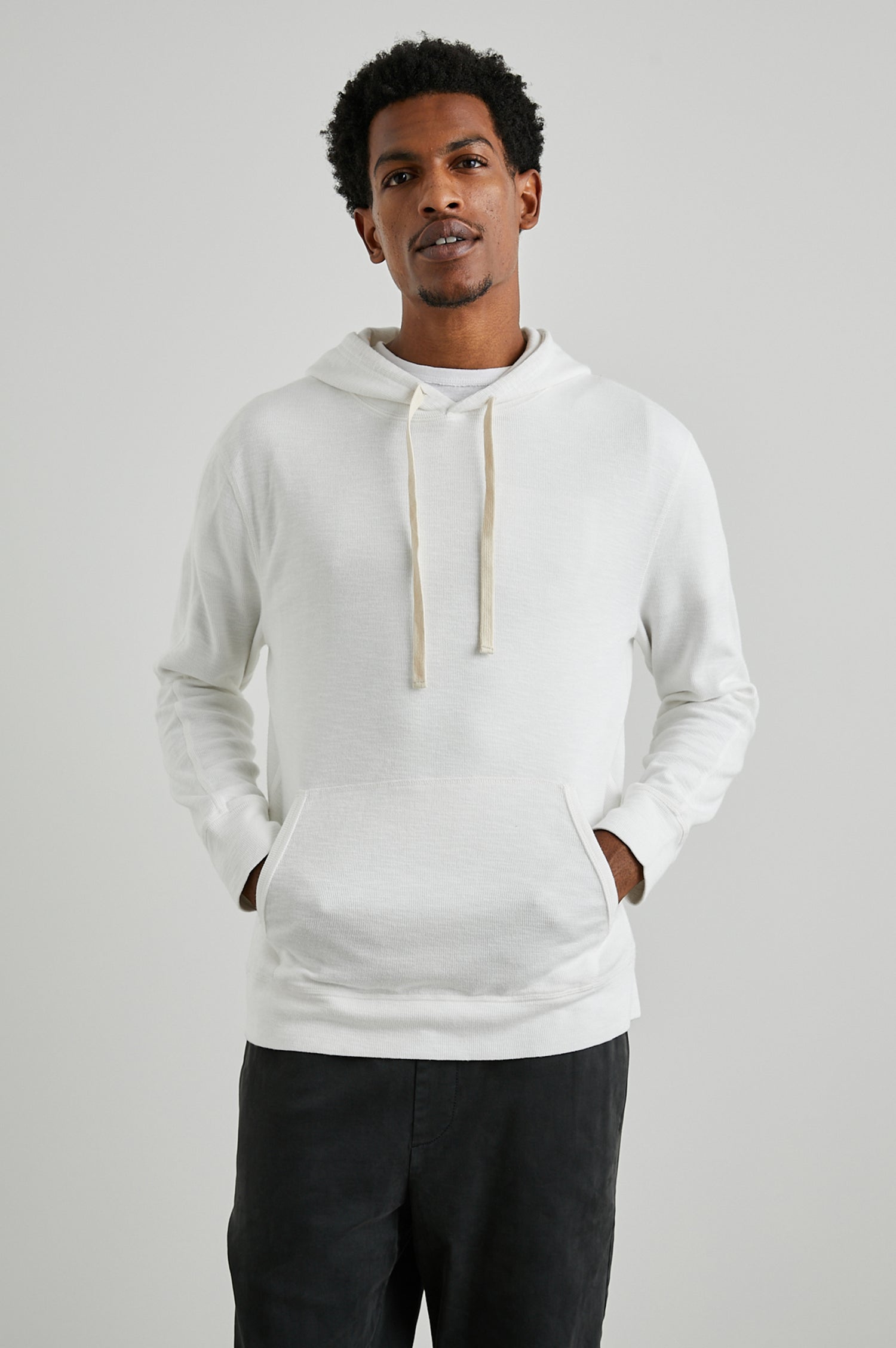Mammoth Long-Sleeve Hoodie with a Kangaroo Pocket and Drawstring Hood in Whitecap Colorway - Front View Featured on Model
