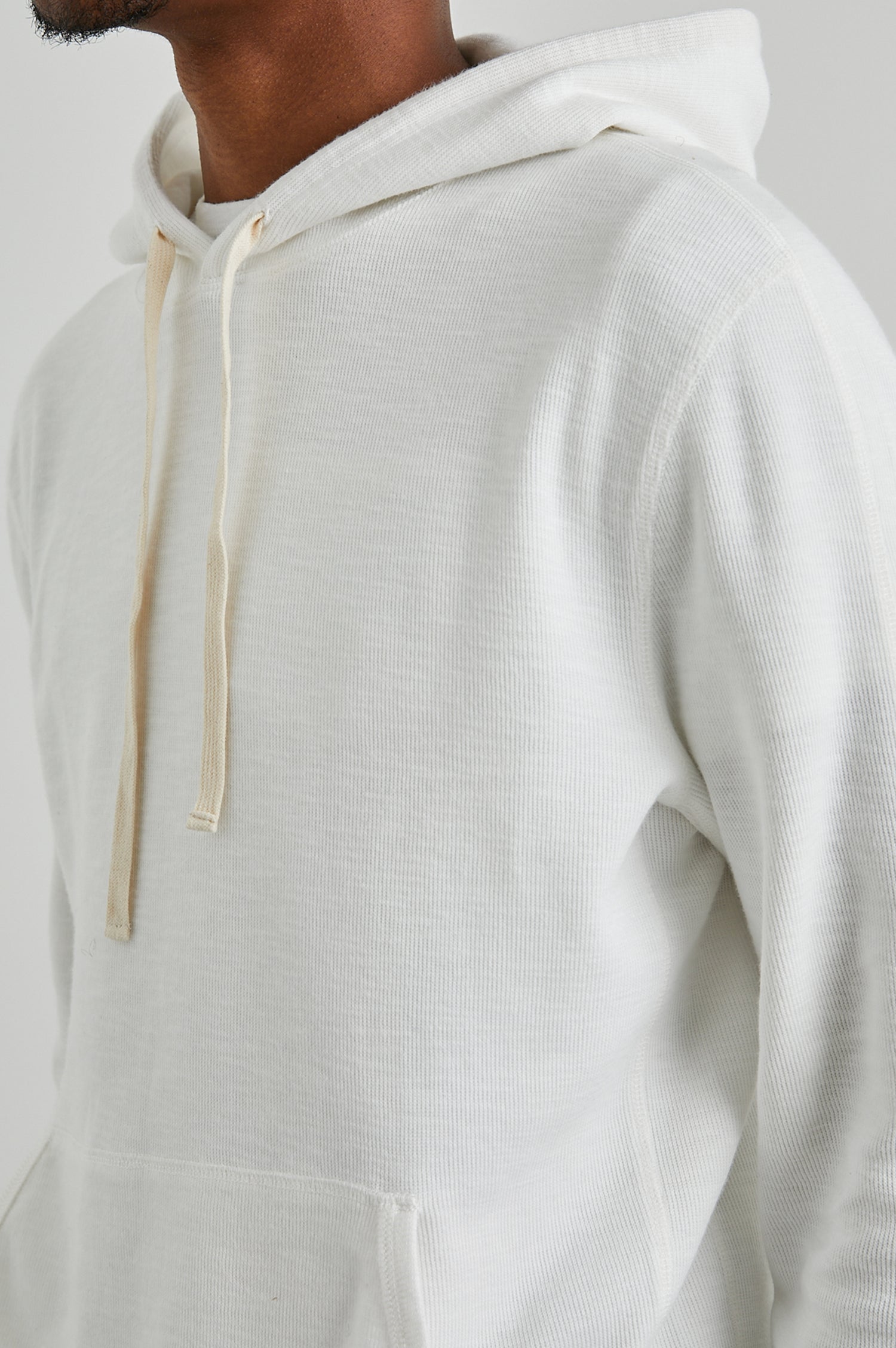 Mammoth Long-Sleeve Hoodie with a Kangaroo Pocket and Drawstring Hood in Whitecap Colorway - Front View Featured on Model