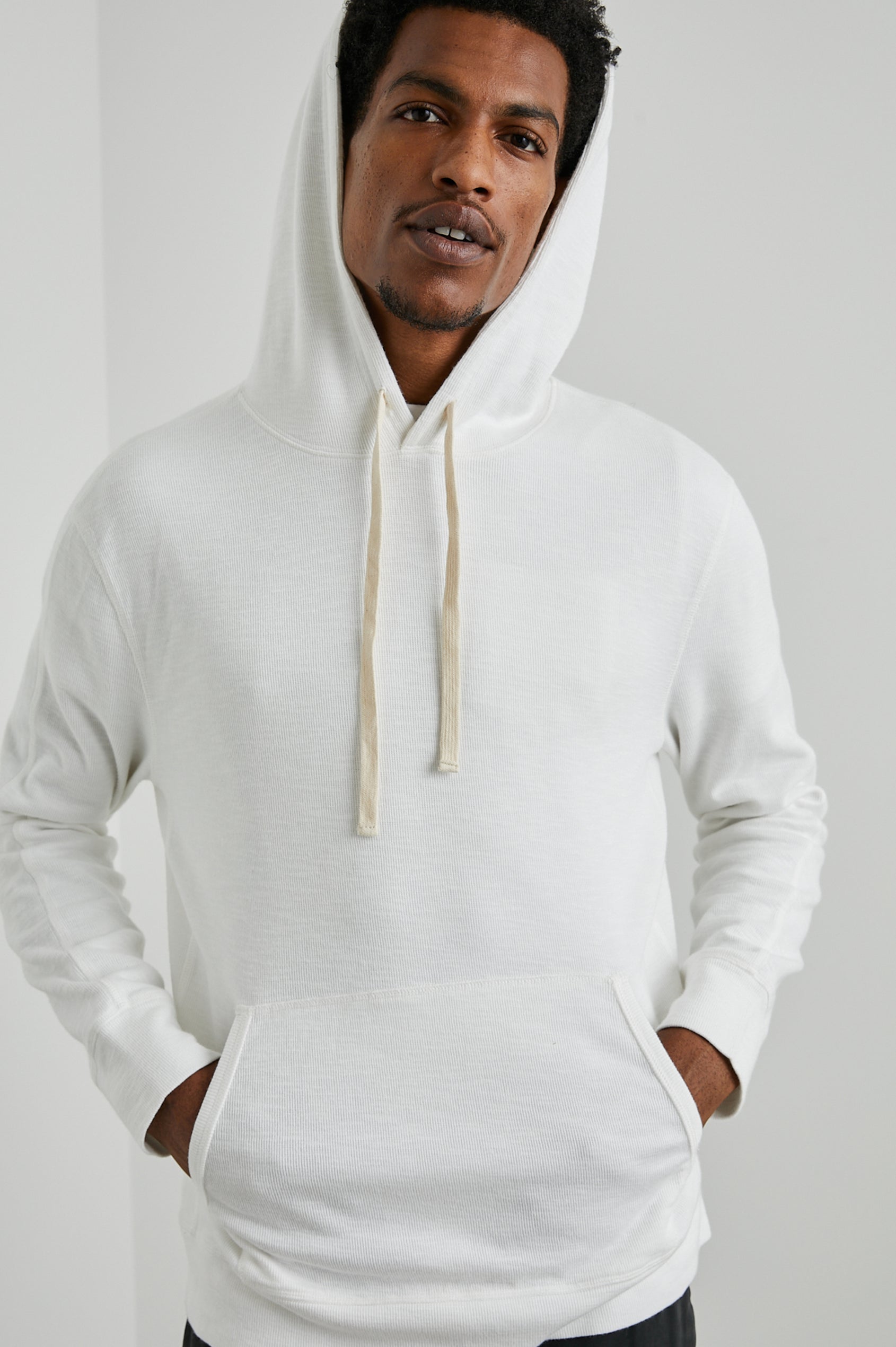 Mammoth Long-Sleeve Hoodie with a Kangaroo Pocket and Drawstring Hood in Whitecap Colorway - Front View Featured on Model