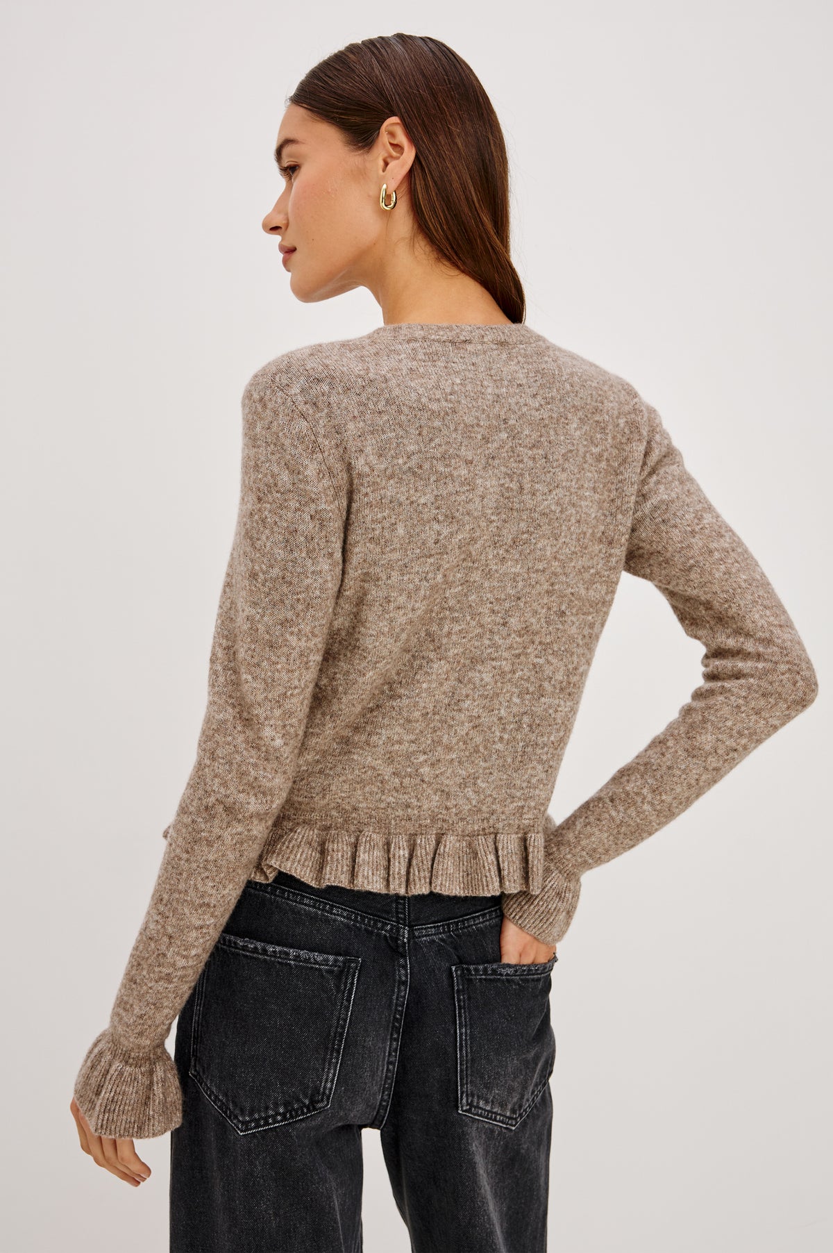 Mandy Sweater in Cashmere-Cotton-Wool Blend Knit Front Buttons, Long Sleeves, Classic Slightly Cropped Fit, and Ribbed Ruffle Trim in Heather Latte Colorway - Back Crop View Featured on Model.