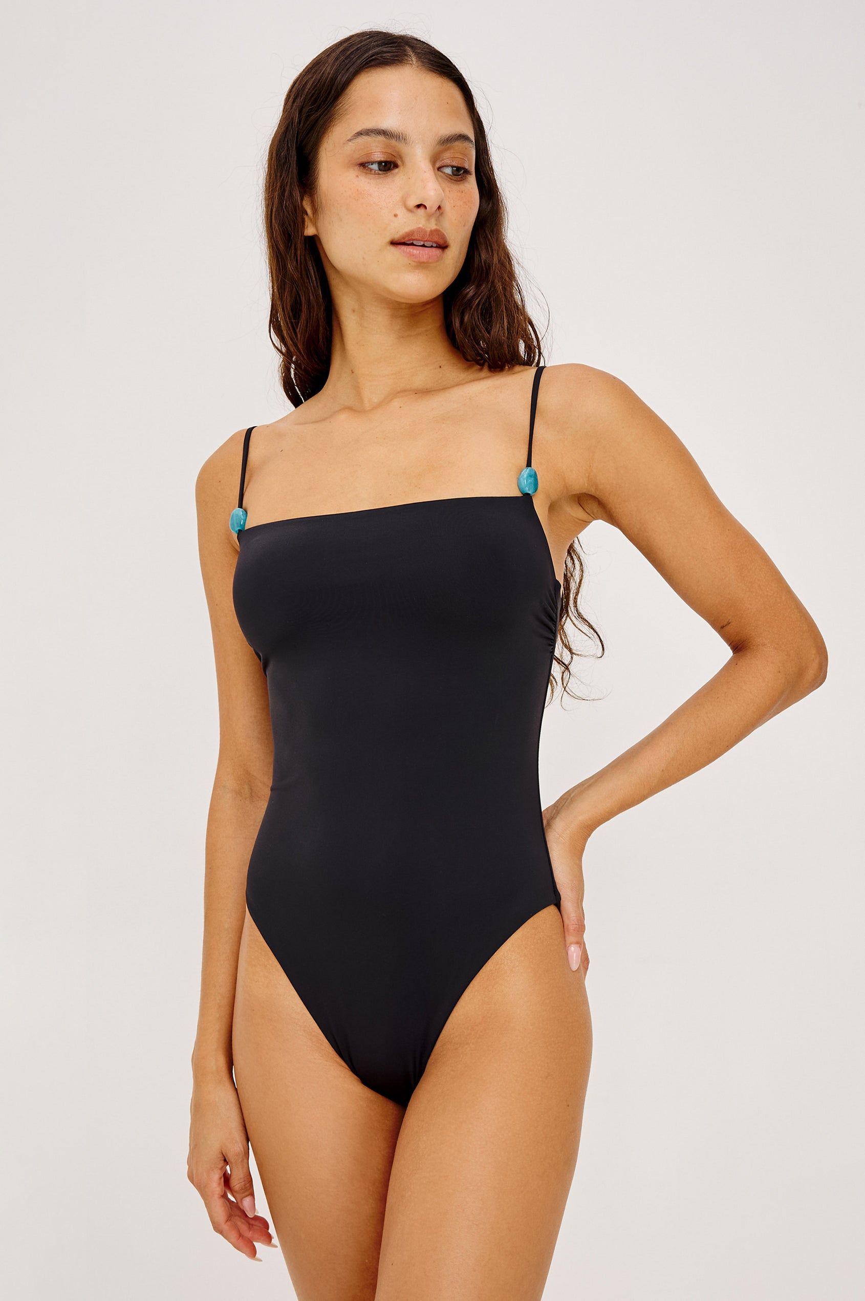 Marbella One Piece Swimsuit With Straight Neckline, Adjustable Beaded Shoulder Straps, and Classic Rear Coverage in Black Colorway - Upper Body Front View Featured on Model