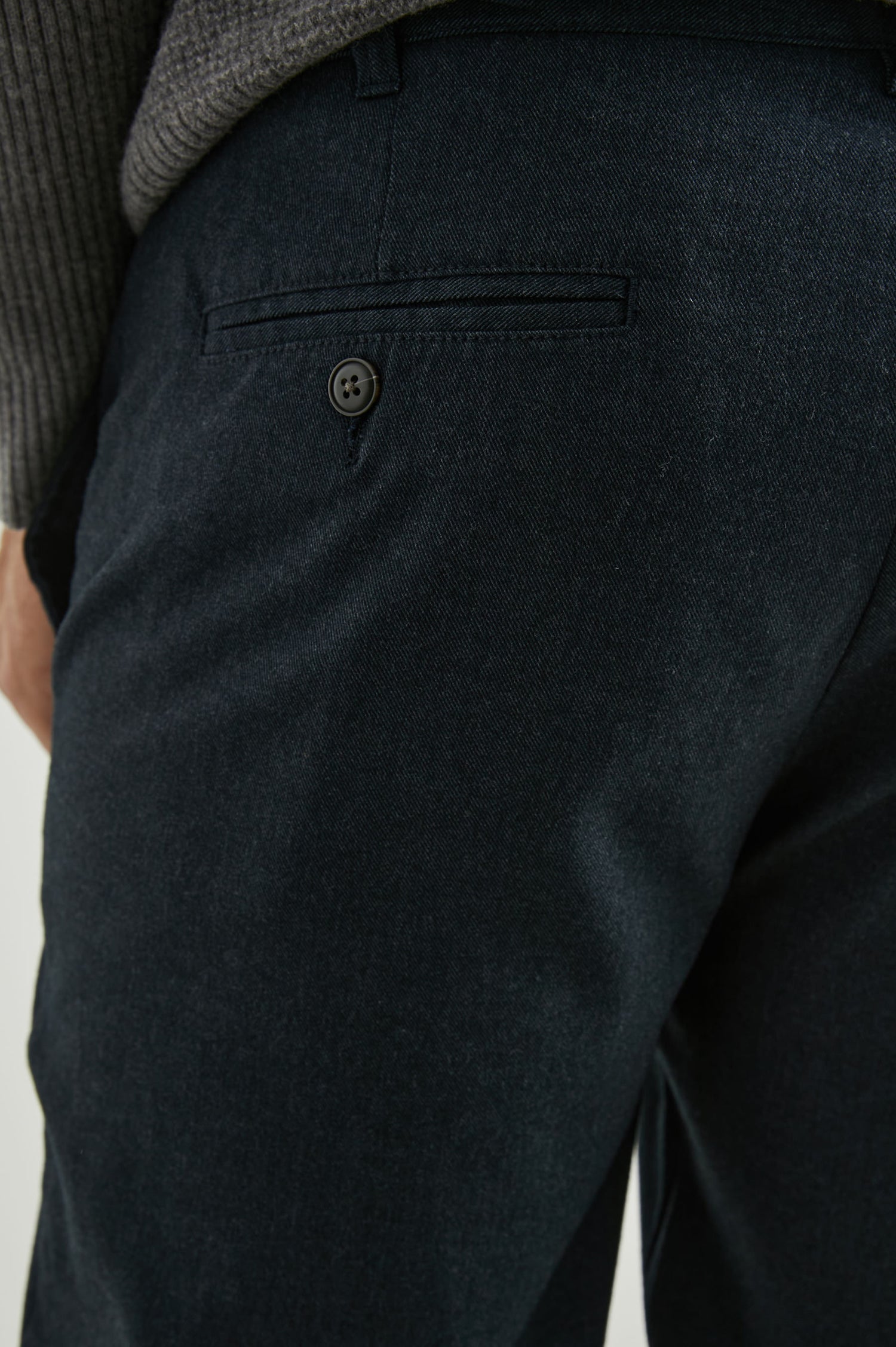 Marcellus Pants with Belt Loops, Two Seam Front Pockets, a Front Buttoned Flap Pocket, a Back Buttoned Welt Pocket and a Back Welt Pocket in Dark Navy Colorway - Back View Featured on Model 