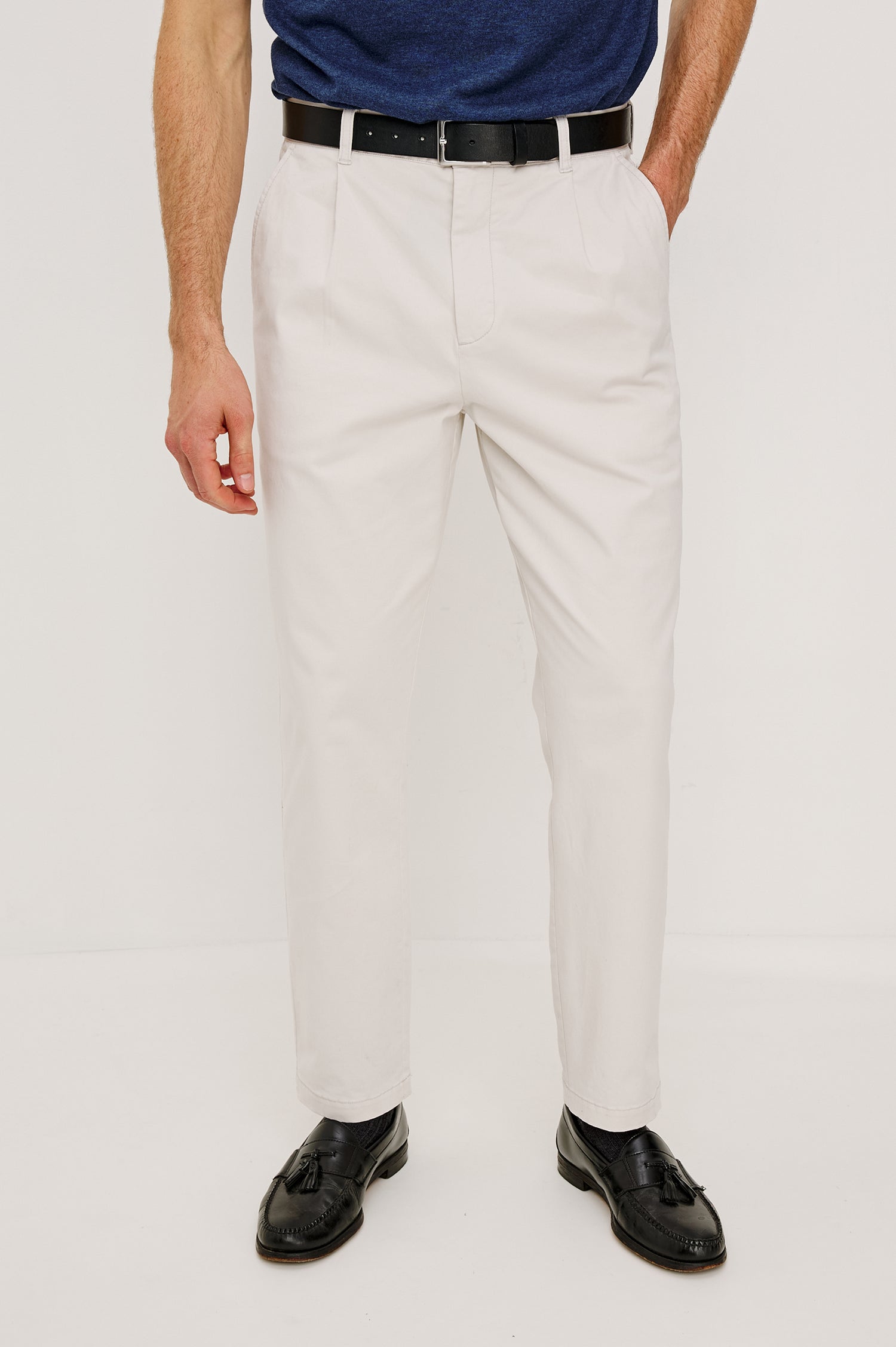 Marcellus Pants with Belt Loops, Two Seam Front Pockets, a Front Buttoned Flap Pocket, a Back Buttoned Welt Pocket and a Back Welt Pocket in Faded Blue Colorway - Lower Body Front View Featured on Model