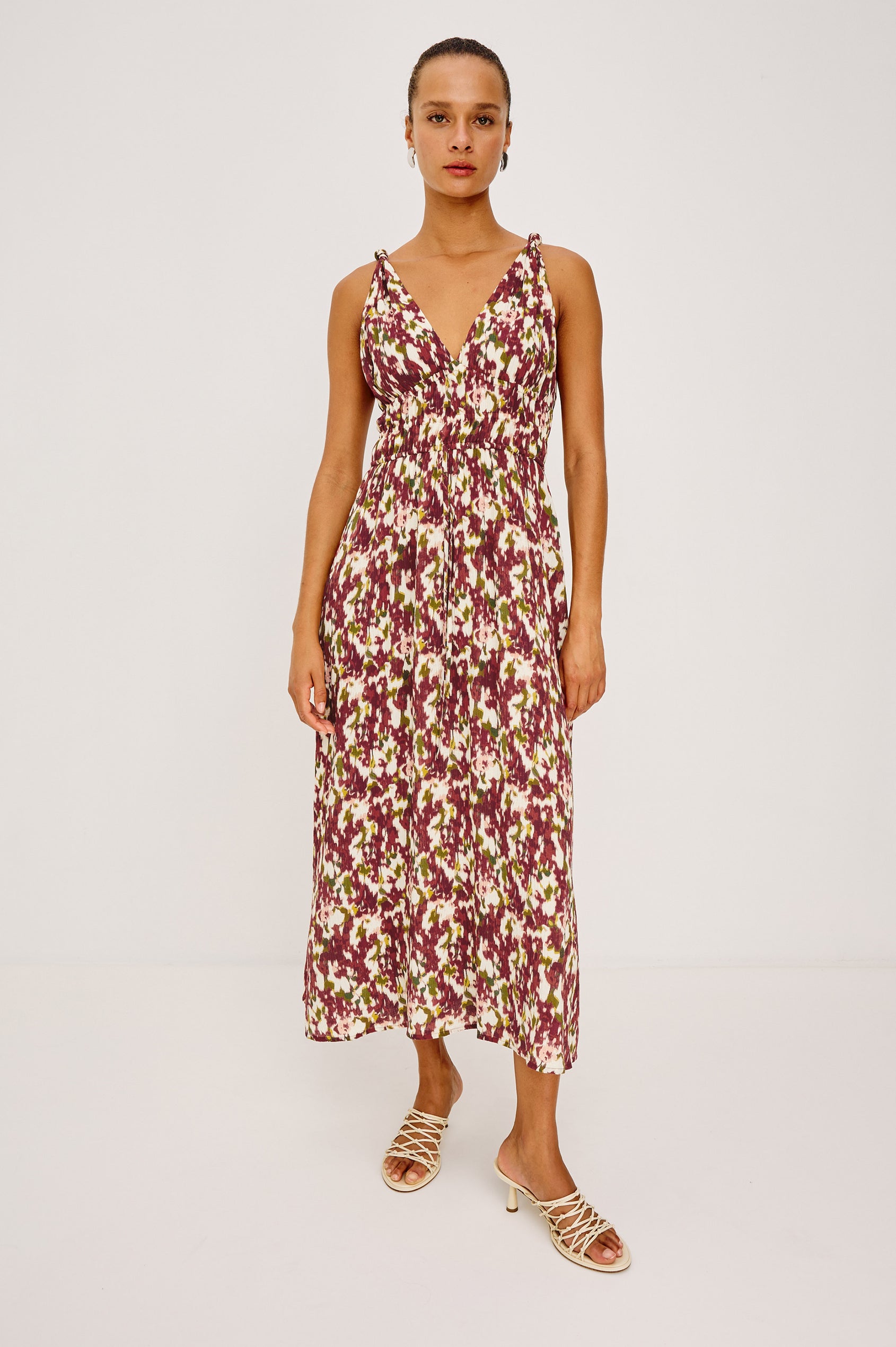 Marciana Midi Dress in Crinkle Chiffon With V-Neckline, Knotted Shoulder Straps, Smocked Waist, Adjustable Empire Waist Ties, and is Fully Lined in Cardinal Floral Colorway - Full Body Front View Featured on Model