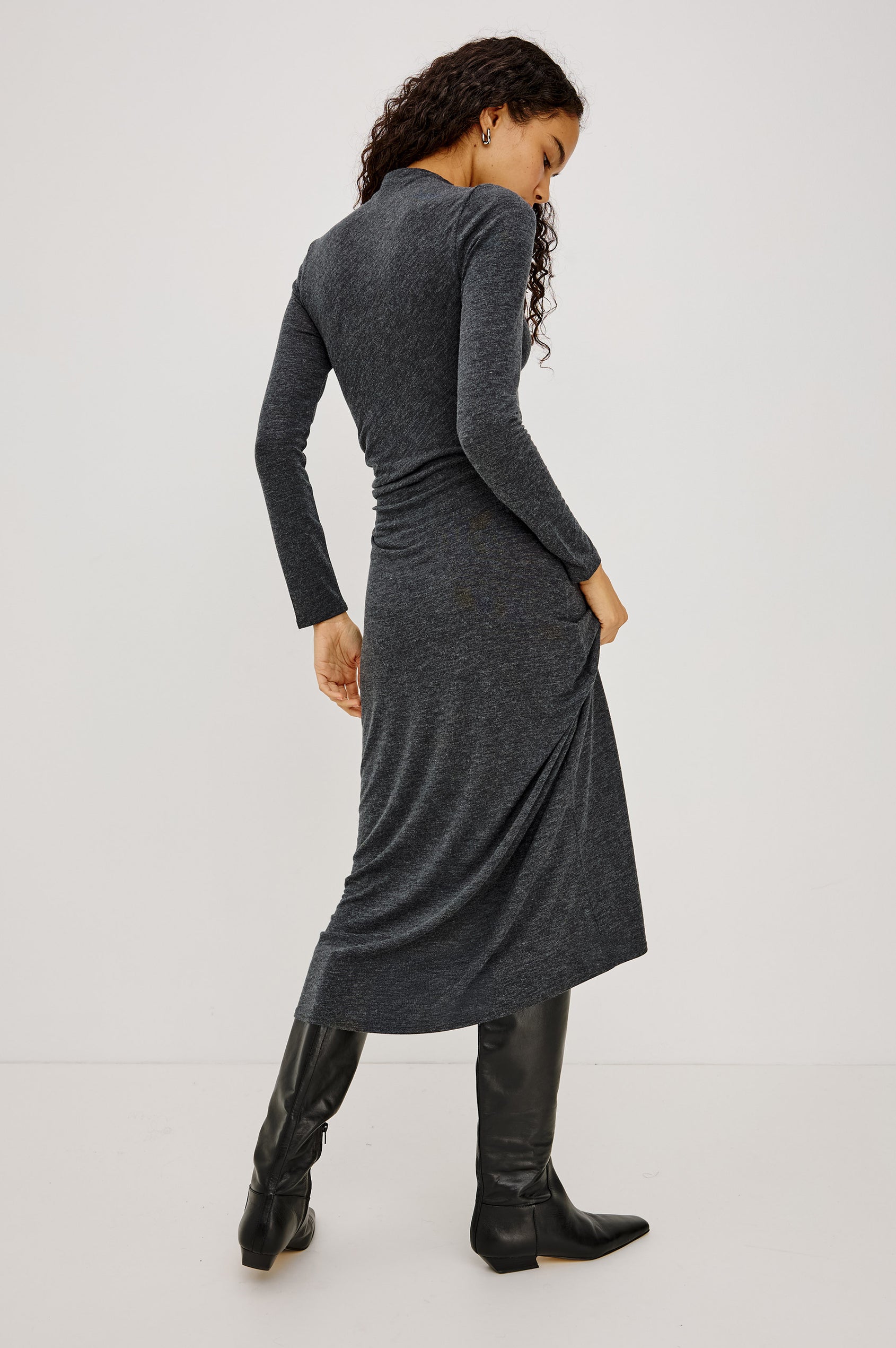 Margaret Midi Dress in Brushed Tissue Jersey With Mock Neck, Long Sleeves, Ruched Sides, and Fitted Silhouette in Charcoal Colorway - Full Body Back View Featured on Model