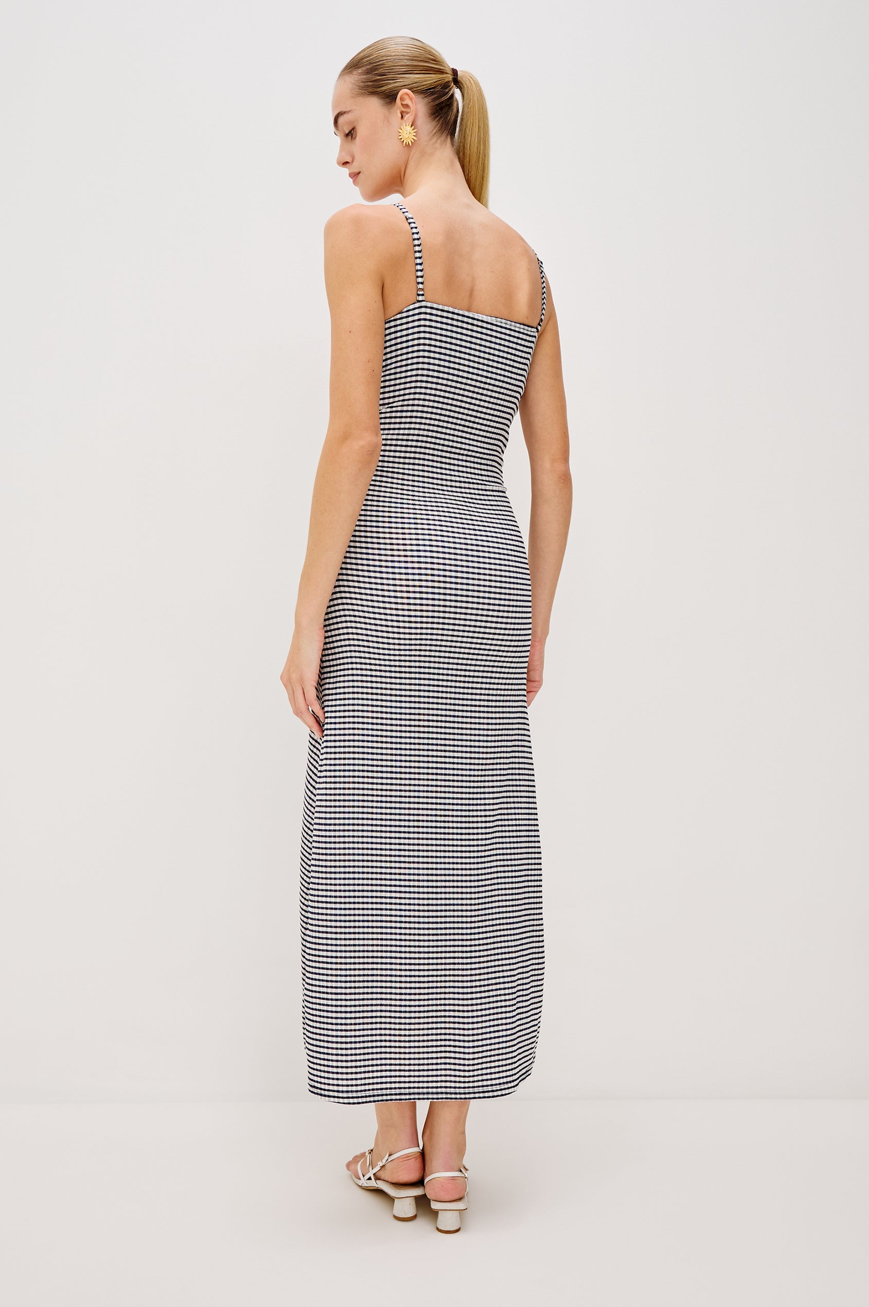 Mari Midi Dress with Spaghetti Straps, V-Front, A-Line Silhouette and Gathering Down Center Front in Navy Gingham Colorway. Full Body Back View Shown on Model.