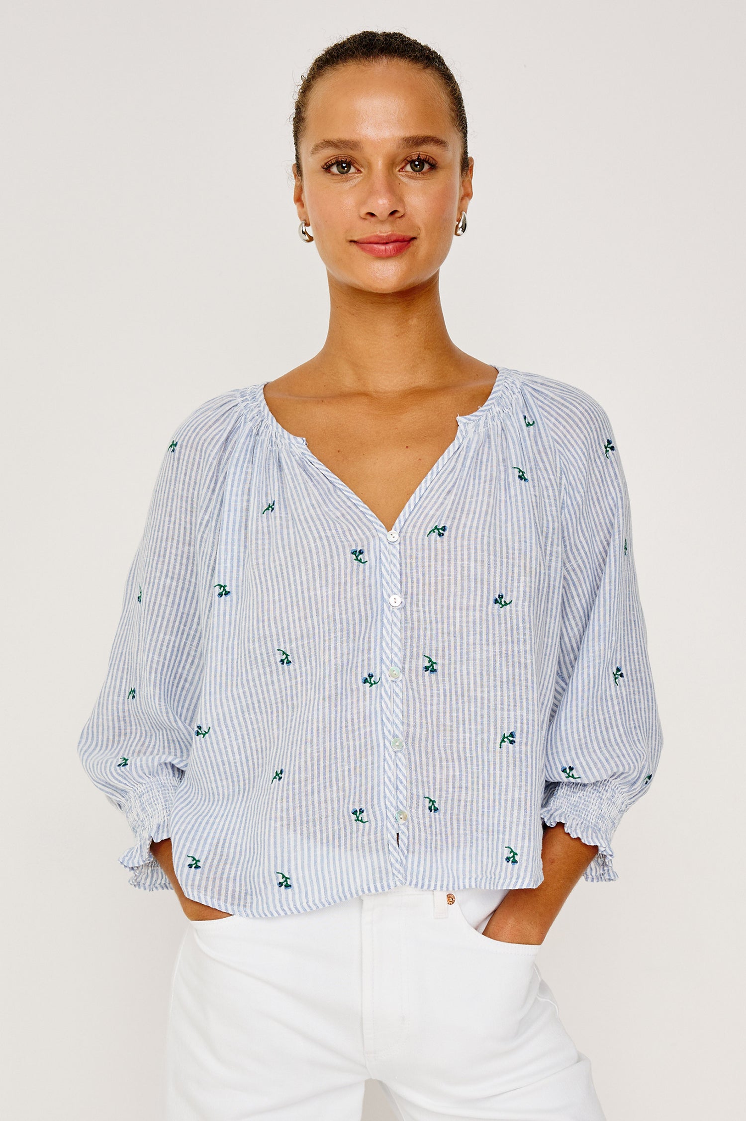 Mariah Peasant Style Bouse Top in Beach Cotton With Split V-Neck Collar, Front Buttons, Smocked Cuffs, and Loose Fit in Bluebell Embroidered Stripe Colorway - Upper Body Front View Featured on Model
