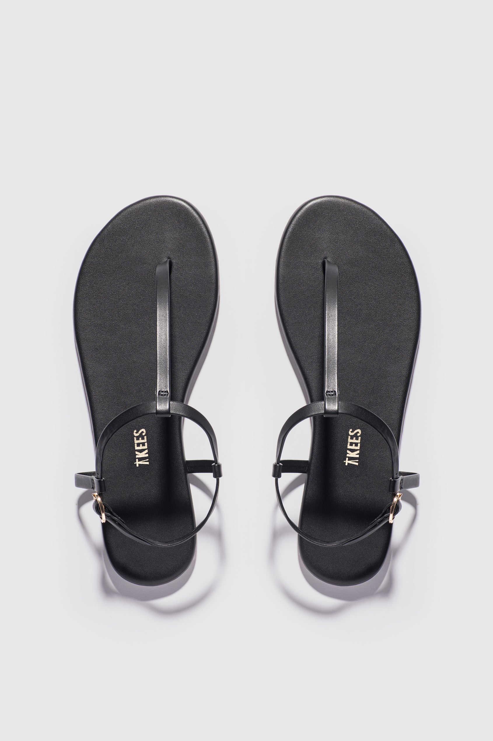 Mariana leather t-strap sandal with ankle strap and buckle in Sable black - pair of shoes shot from above angle